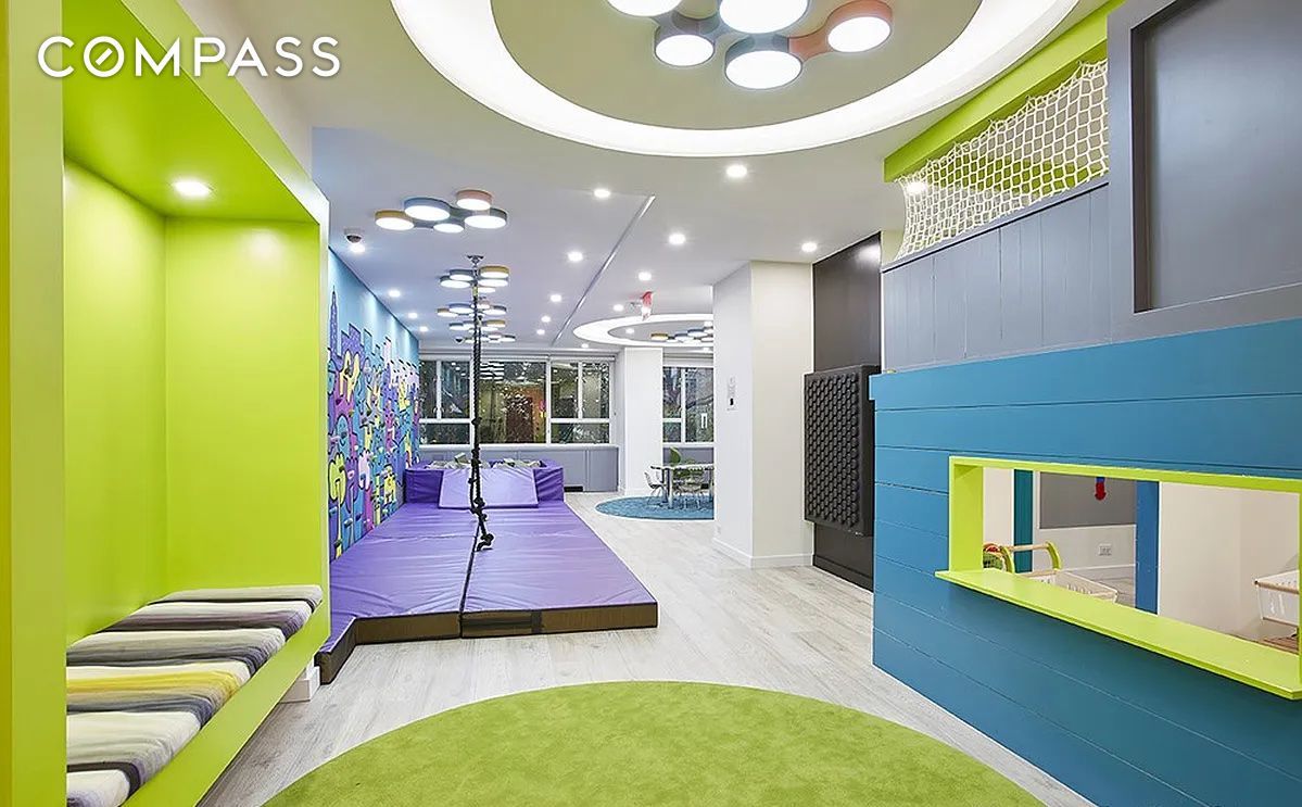 a view of a room with furniture wooden floor and windows