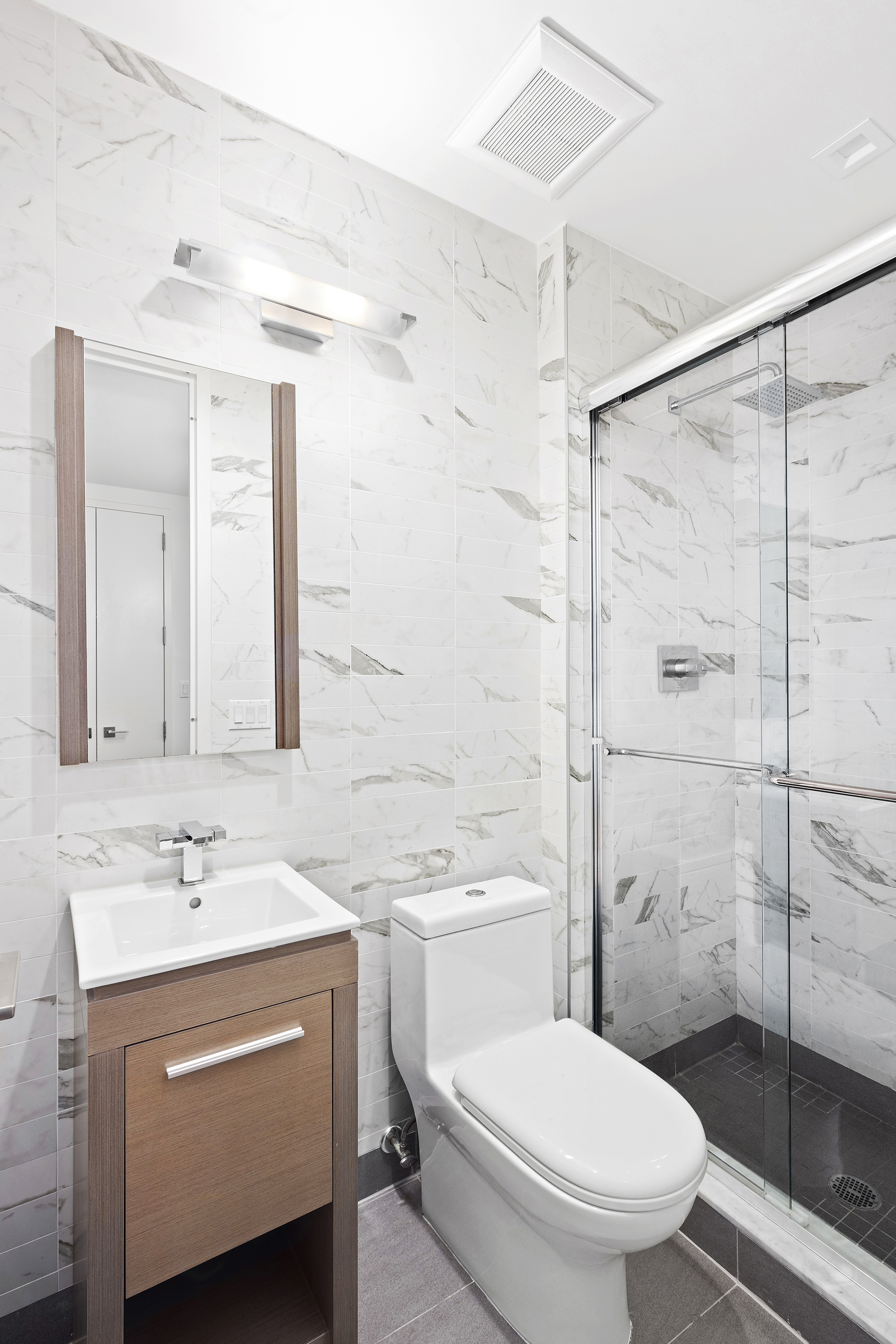 1059 Manhattan Avenue, Unit PHB Brooklyn, NY 11222 - Photo 4 of 8 a bathroom with a sink toilet and shower