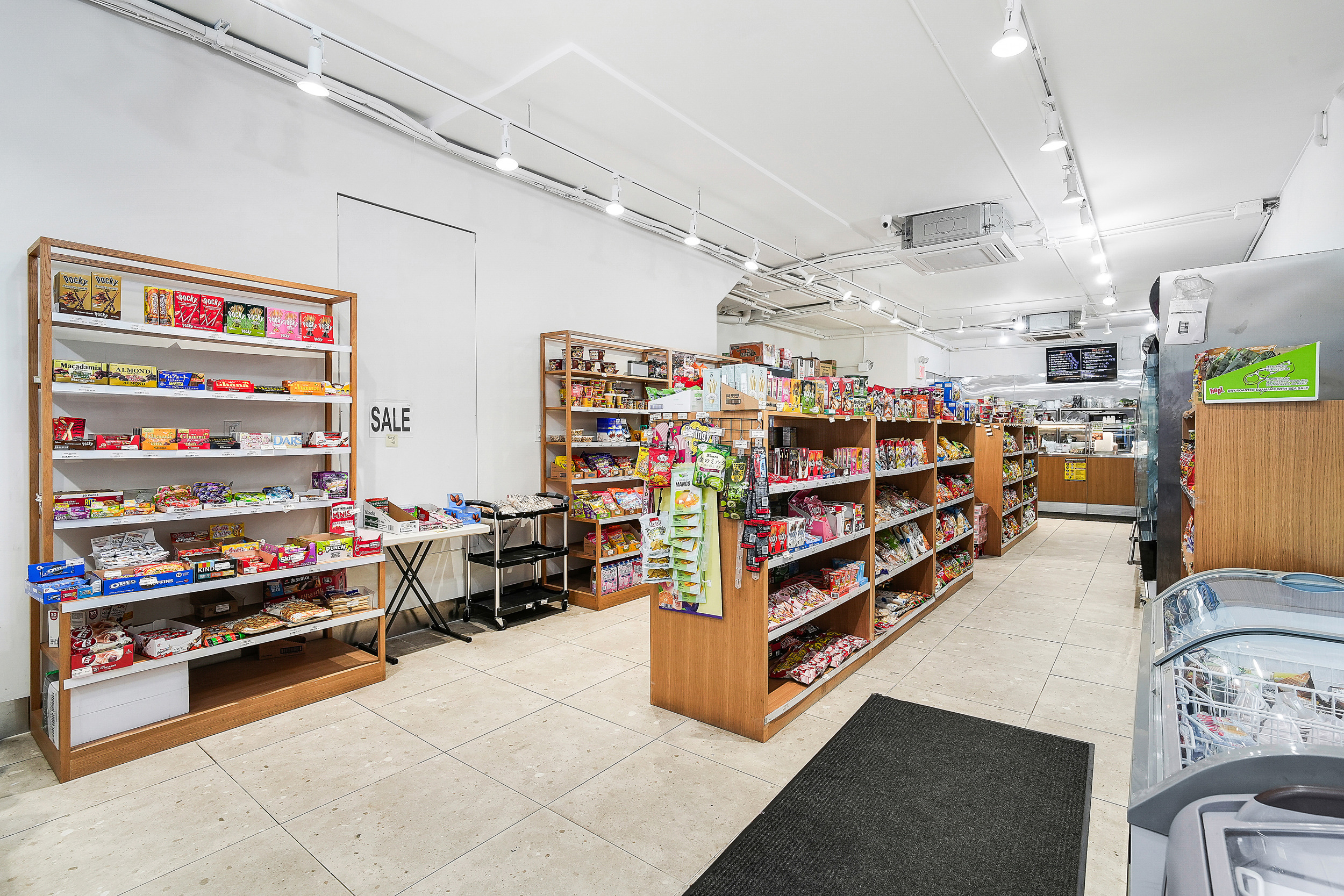 24 Beaver Street Manhattan, NY 10004 - Photo 3 of 25 a room with lots of wooden furniture and toys
