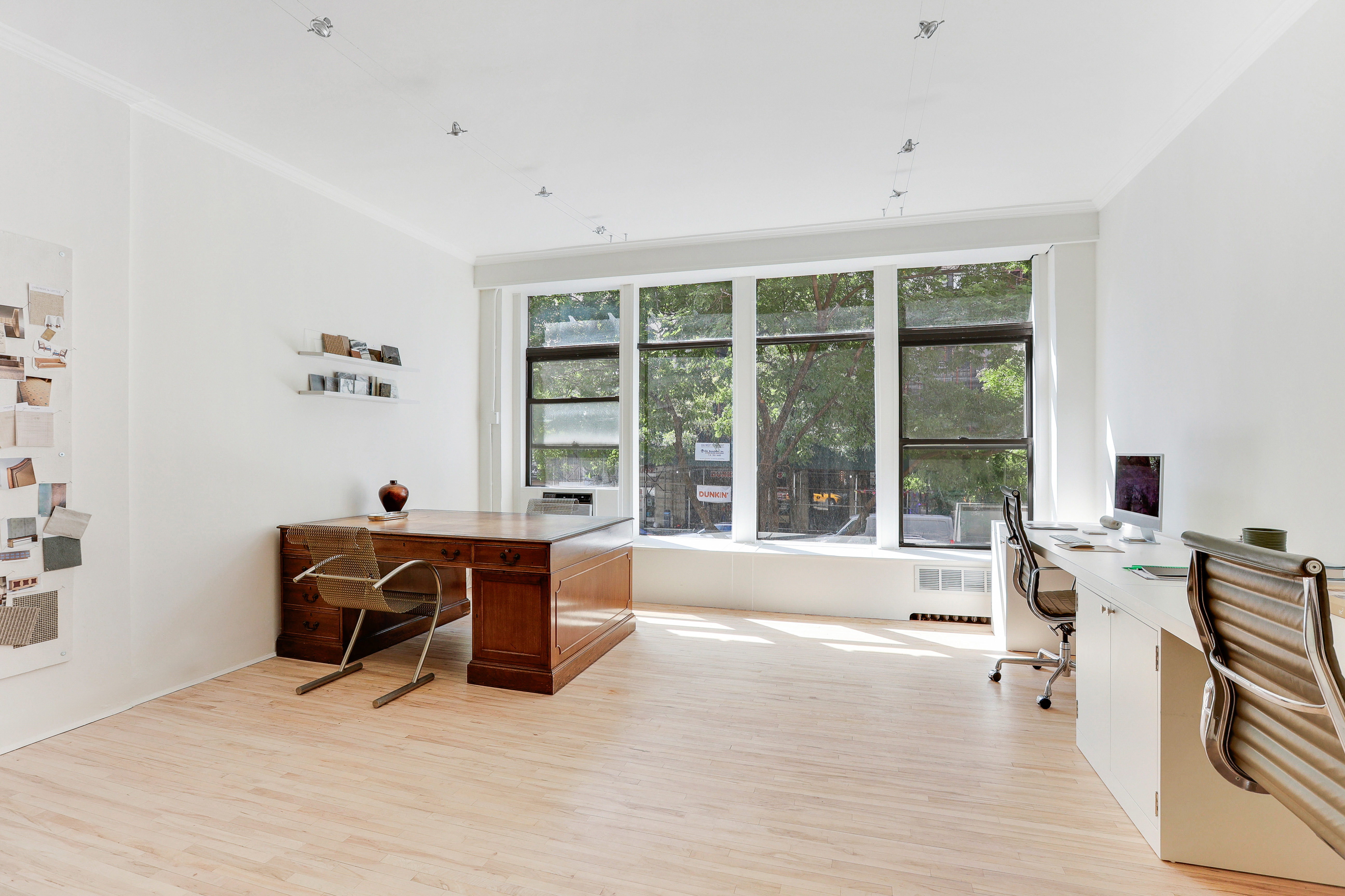 167 West 72nd Street Manhattan, NY 10023 - Photo 4 of 25 a living room with furniture and large windows