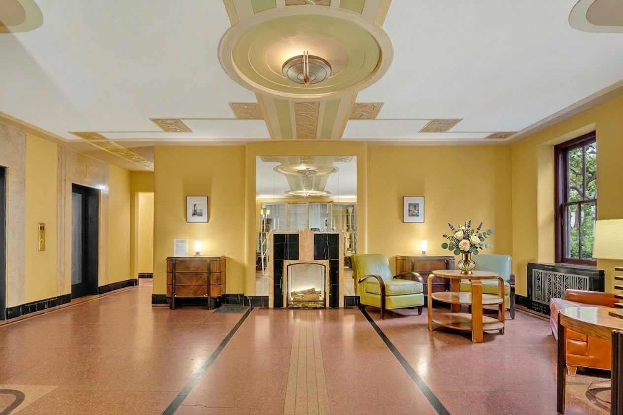 250 Cabrini Boulevard, Unit 9E Manhattan, NY 10033 - Photo 14 of 19 a living room with furniture and a fireplace