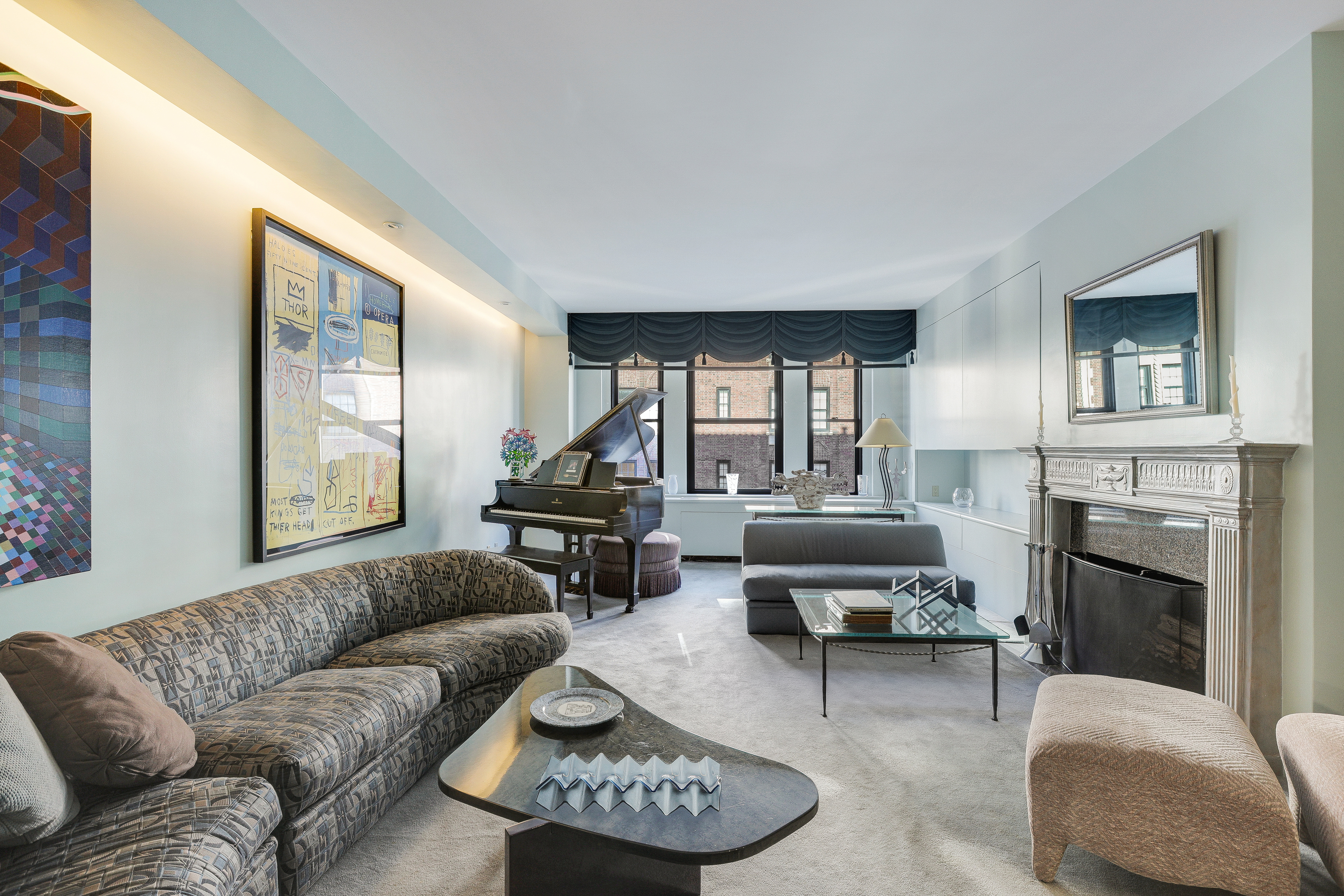 a living room with furniture and a fireplace