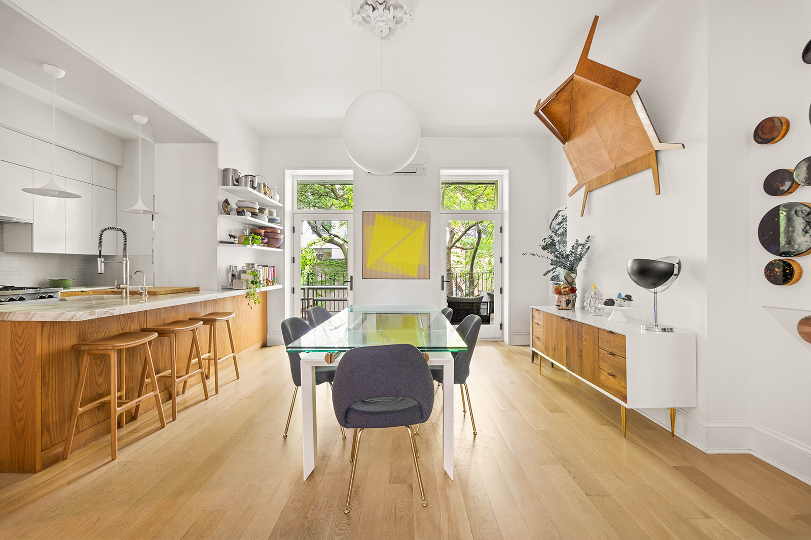 298 State Street, Unit TRIPLEX Brooklyn, NY 11201 - Photo 3 of 21 a living room with stainless steel appliances kitchen island granite countertop a sink a stove a dining table and chairs with wooden floor