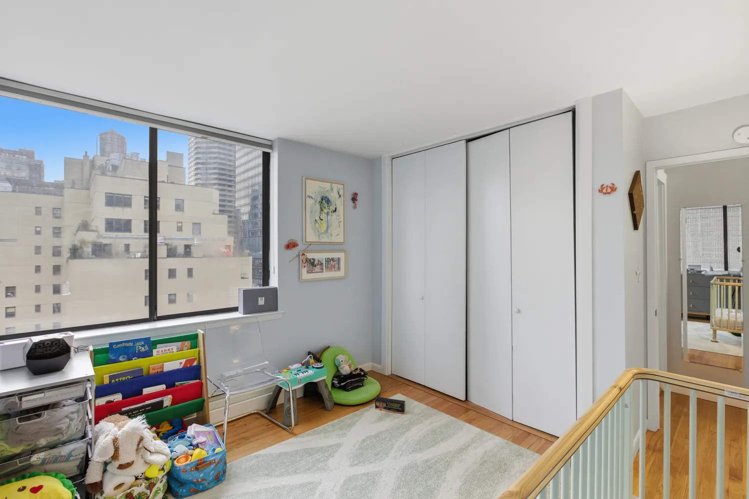 a view of hallway with toys and a window