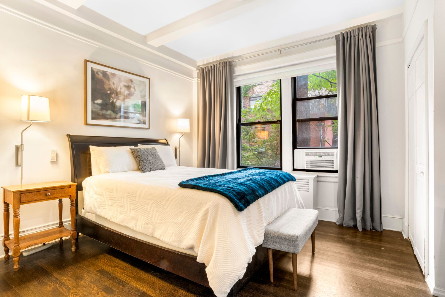 114 West 70th Street, Unit 3D Manhattan, NY 10023 - Photo 4 of 9 a bedroom with a bed and a window