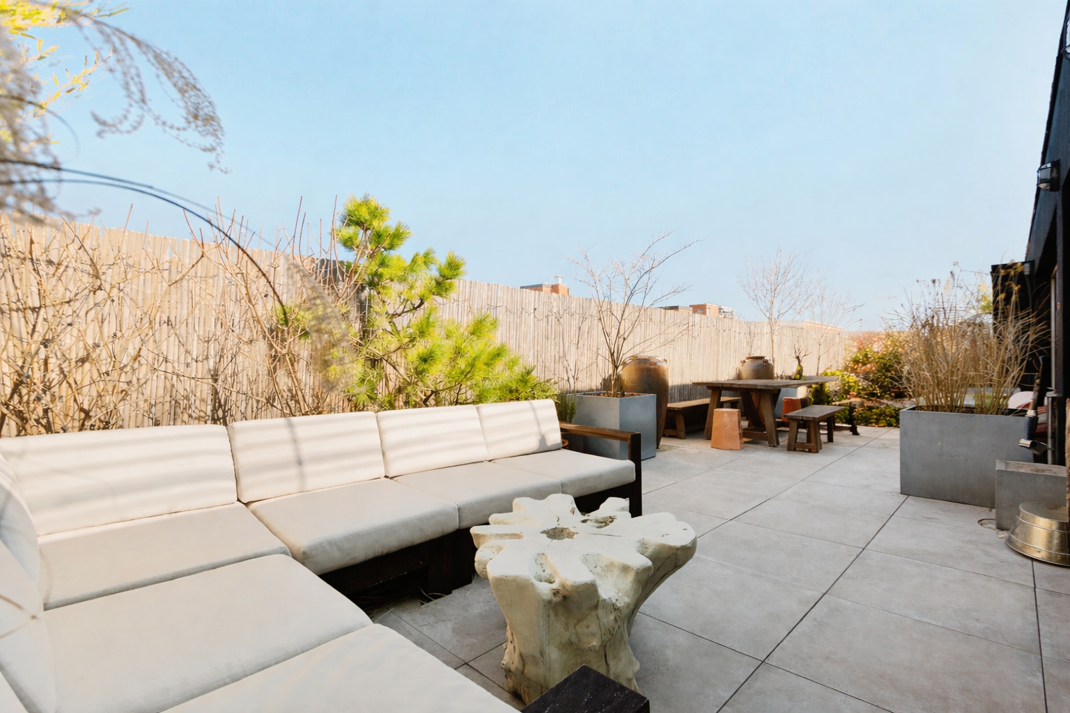 a terrace with outdoor seating and city view
