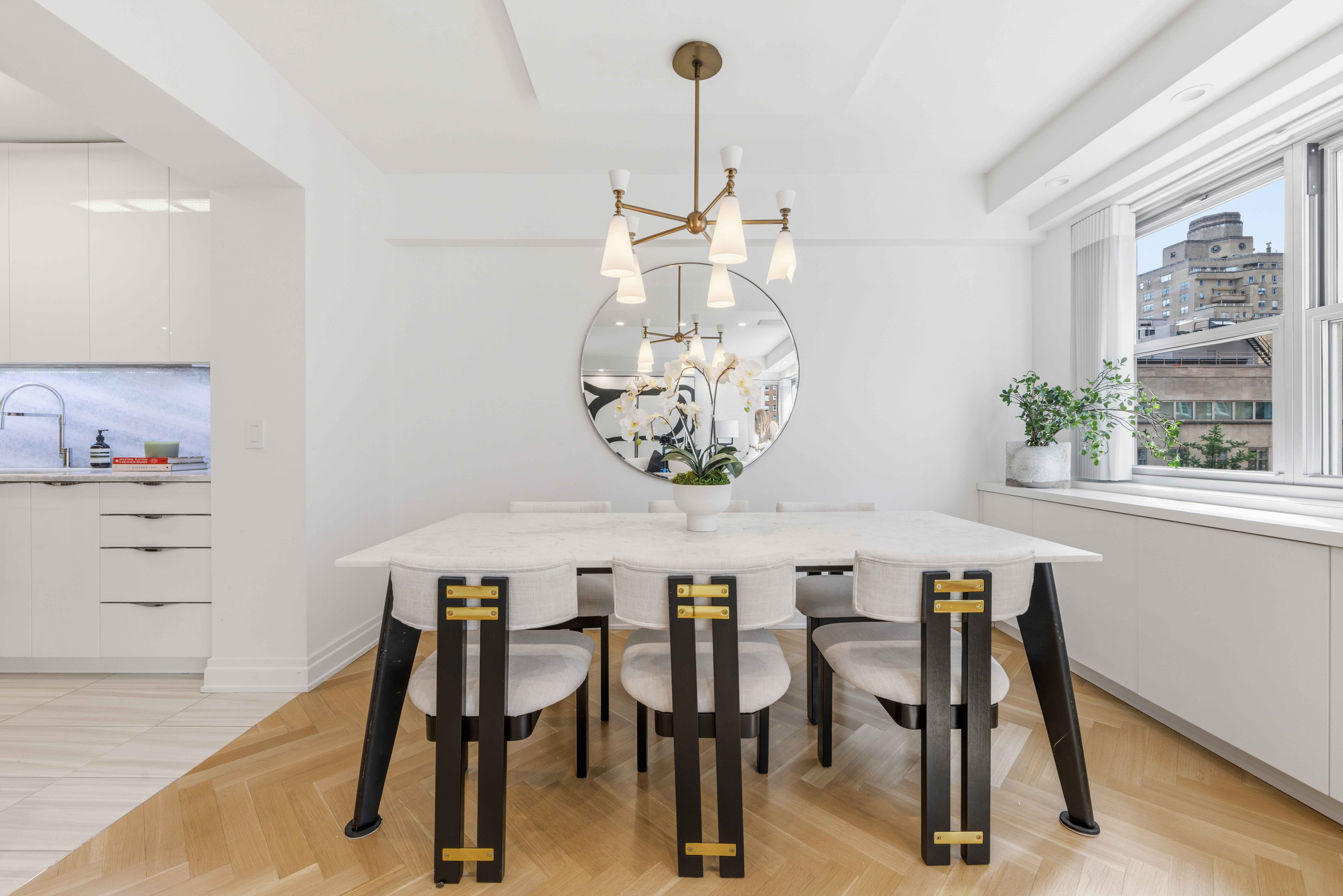 40 East 78th Street, Unit 5E Manhattan, NY 10075 - Photo 9 of 23 a dining room with furniture and window