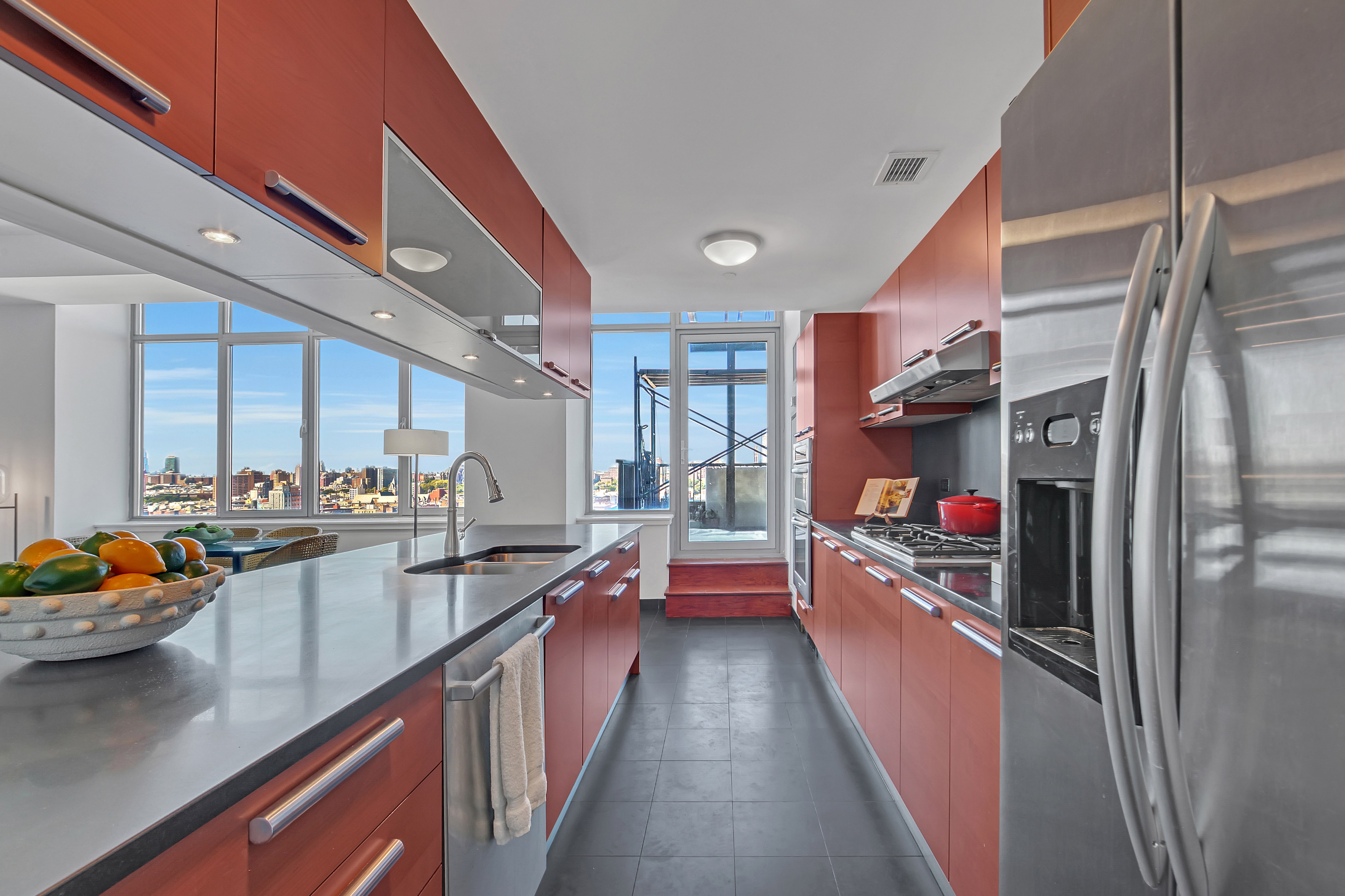 1485 5th Avenue, Unit 18/19H Manhattan, NY 10035 - Photo 5 of 24 a kitchen with lots of counter top space