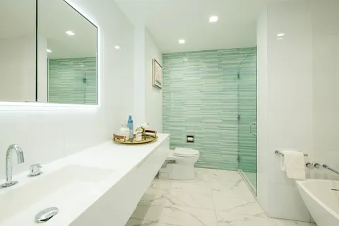 a bathroom with a sink a toilet and tub