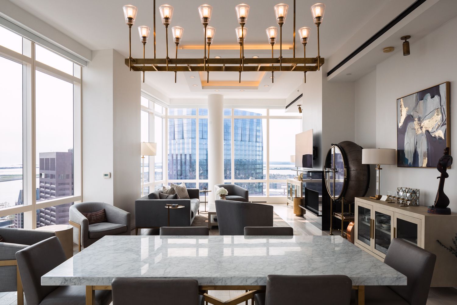 a dining table with chairs and couches