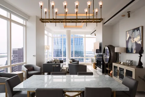 a dining table with chairs and couches