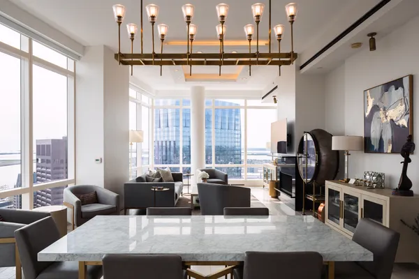 a dining table with chairs and couches