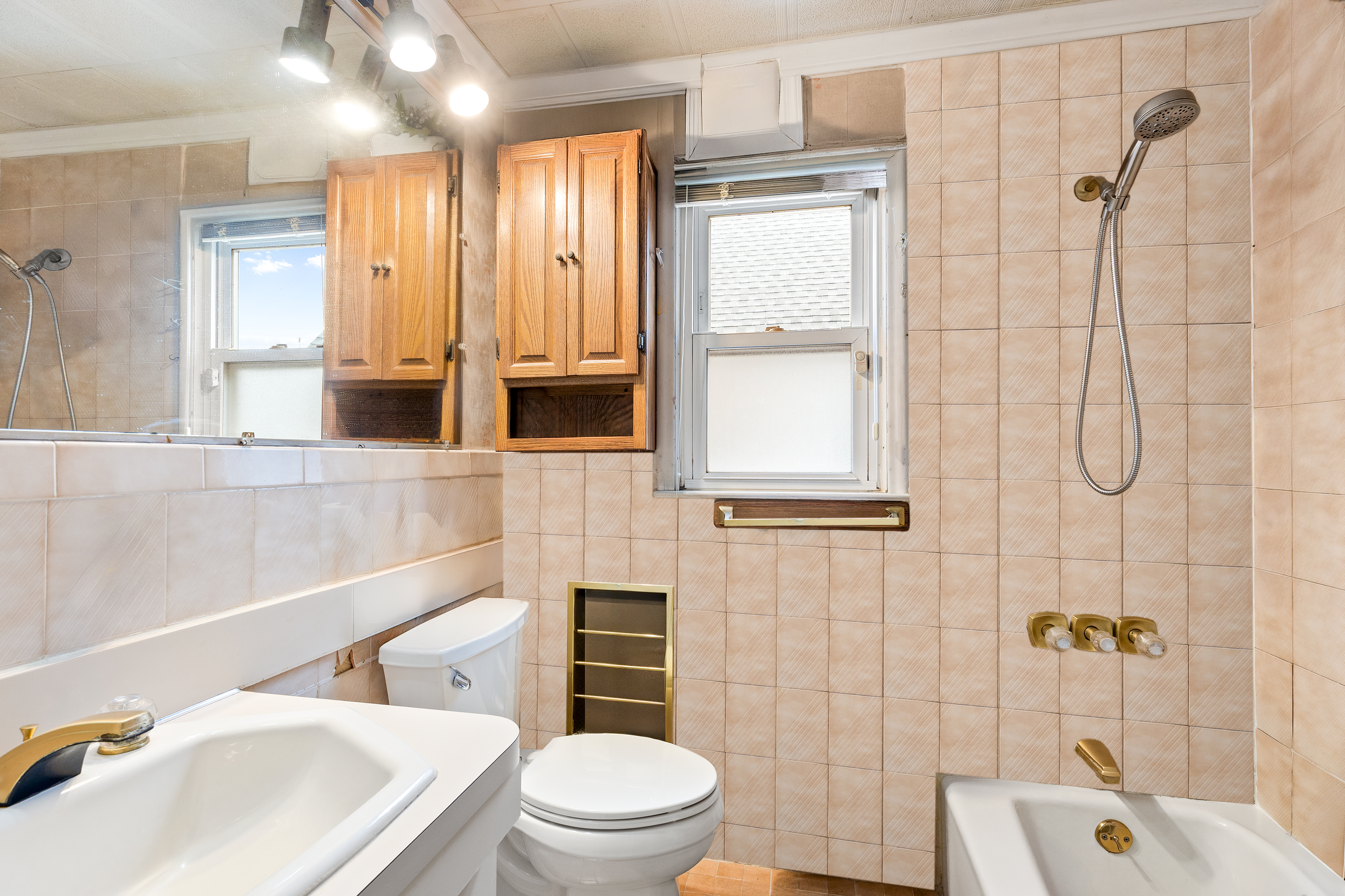 241-12 148th Avenue Queens, NY 11422 - Photo 8 of 15 a bathroom with a sink a toilet and shower