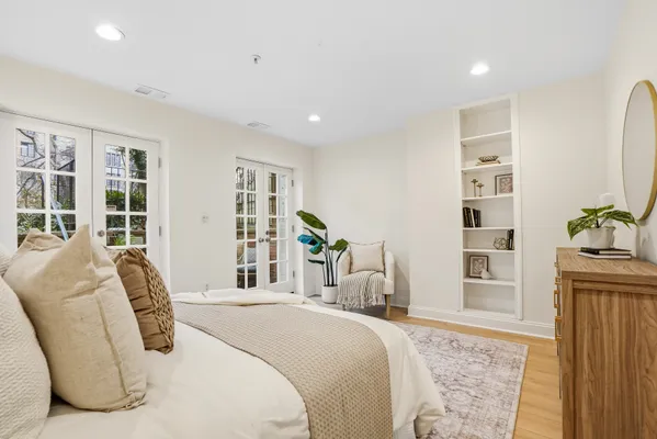 a view of living room filled with furniture and a potted plant