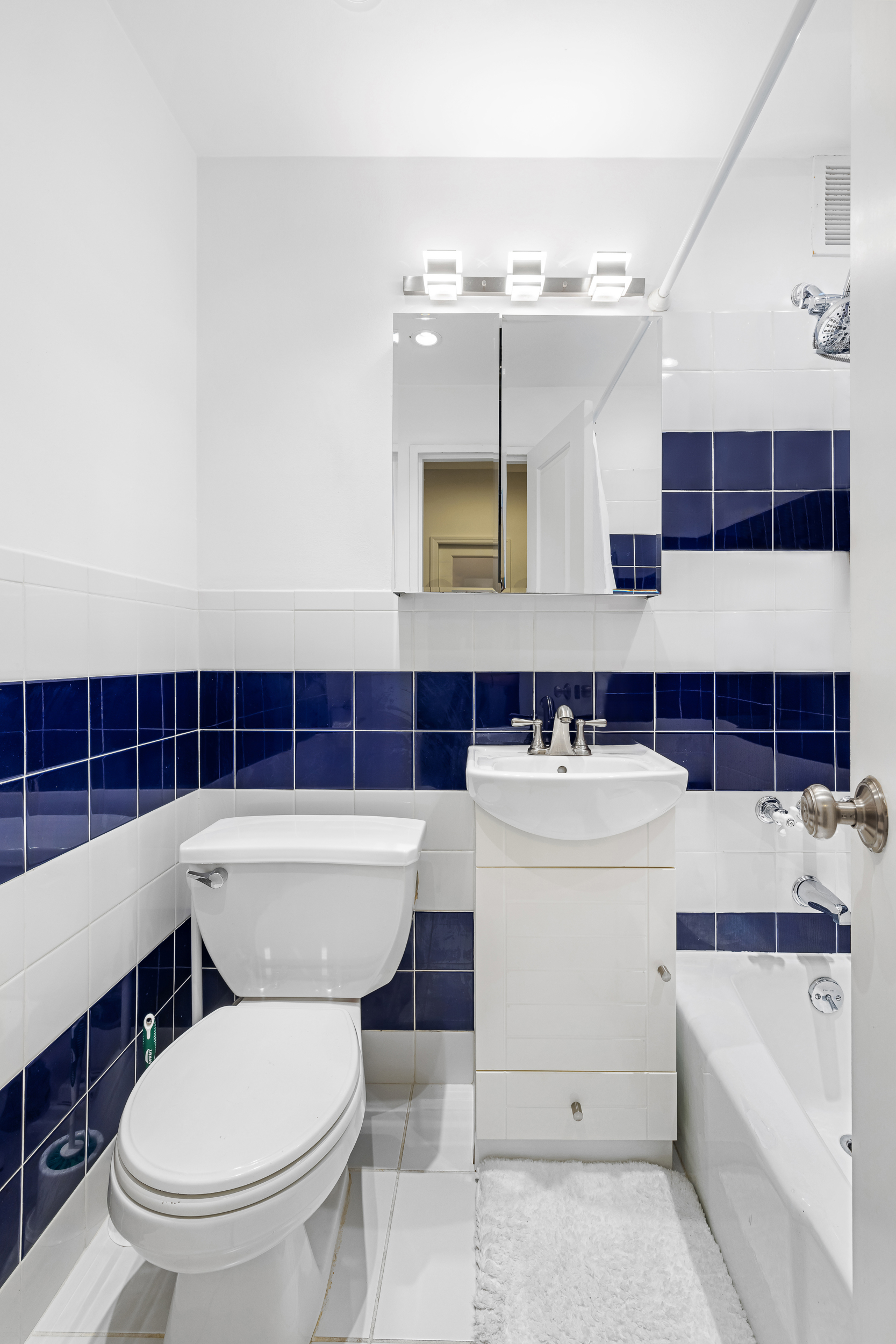 66 Madison Avenue, Unit 1D Manhattan, NY 10016 - Photo 5 of 6 a bathroom with a toilet a sink and a bathtub