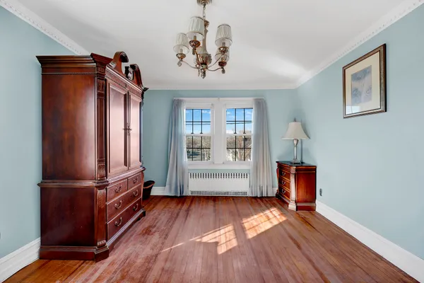 a view of a patio with couches table and chairs and potted plants