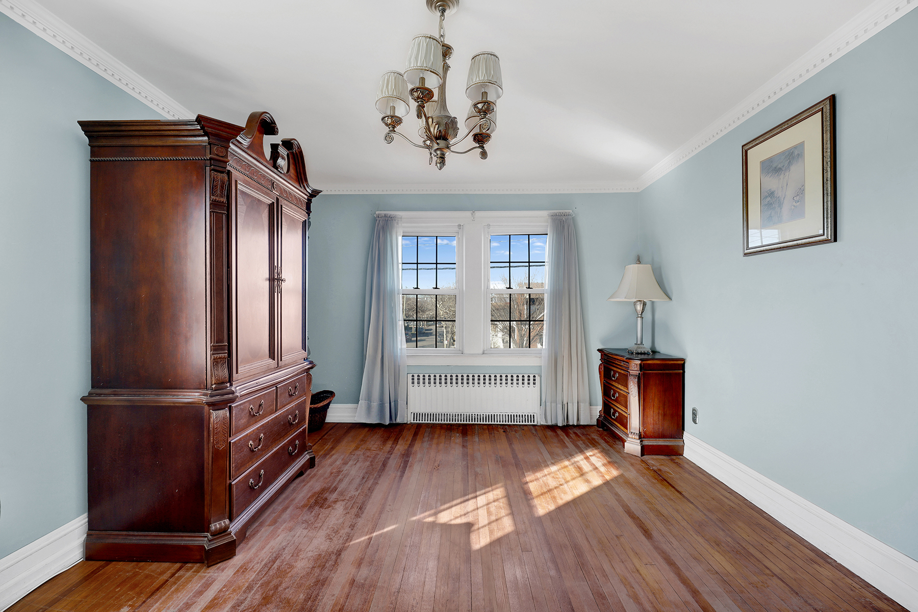 142-15 Newport Avenue Queens, NY 11694 - Photo 29 of 72 a view of hallway with wooden floor and stairs