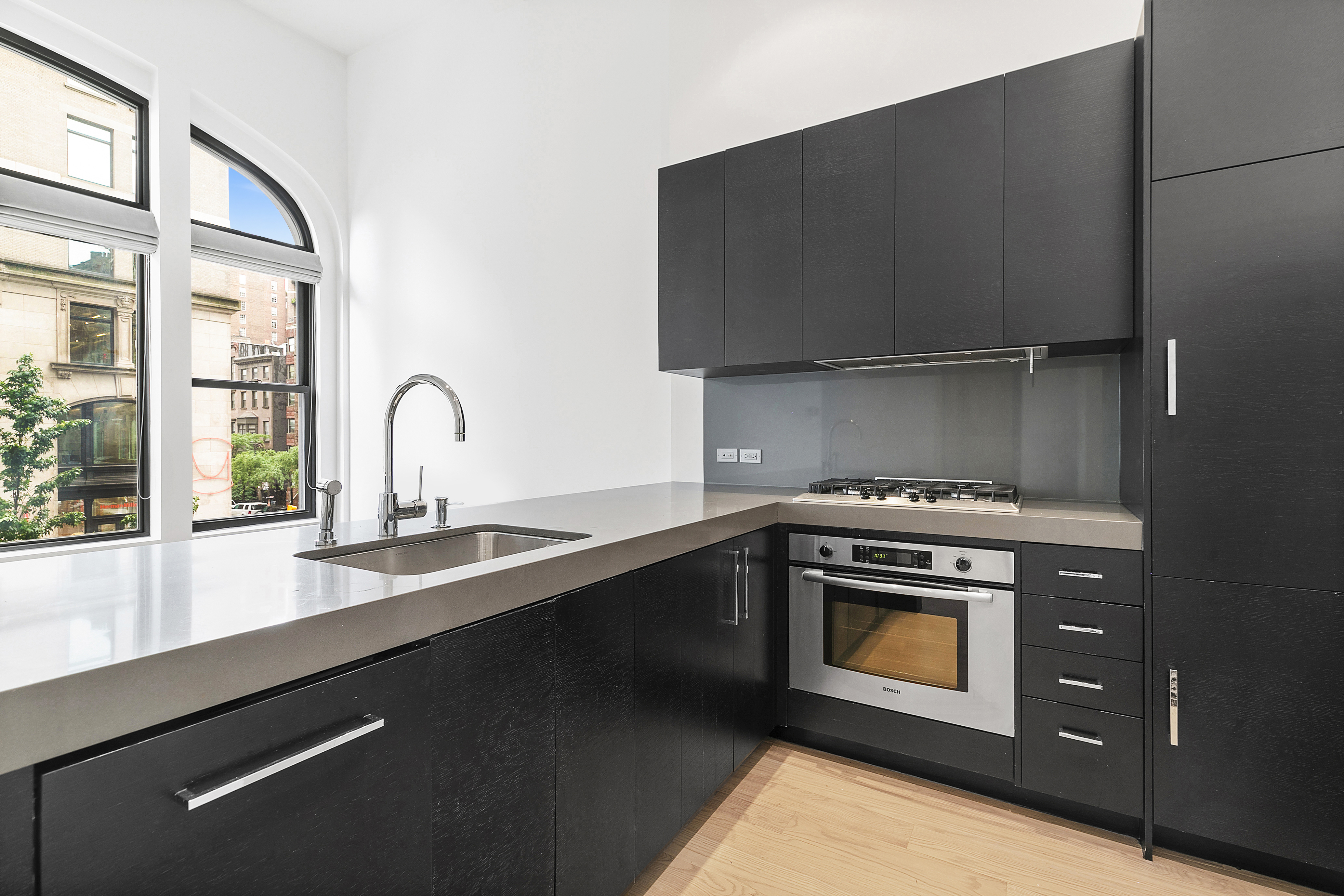 254 Park Avenue South, Unit 3C Manhattan, NY 10010 - Photo 3 of 9 a kitchen with a stove and a sink