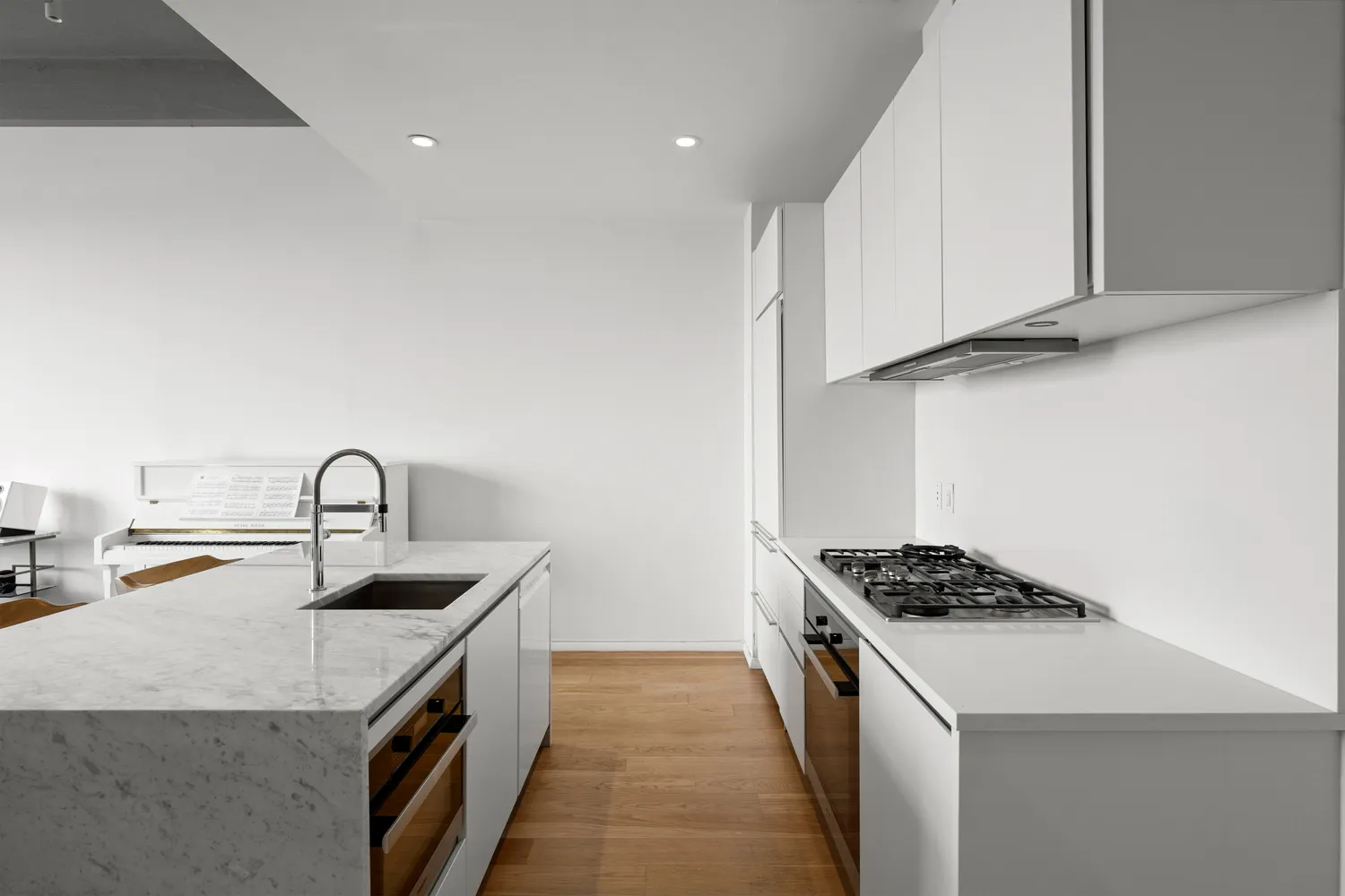 a kitchen that has a sink and a stove