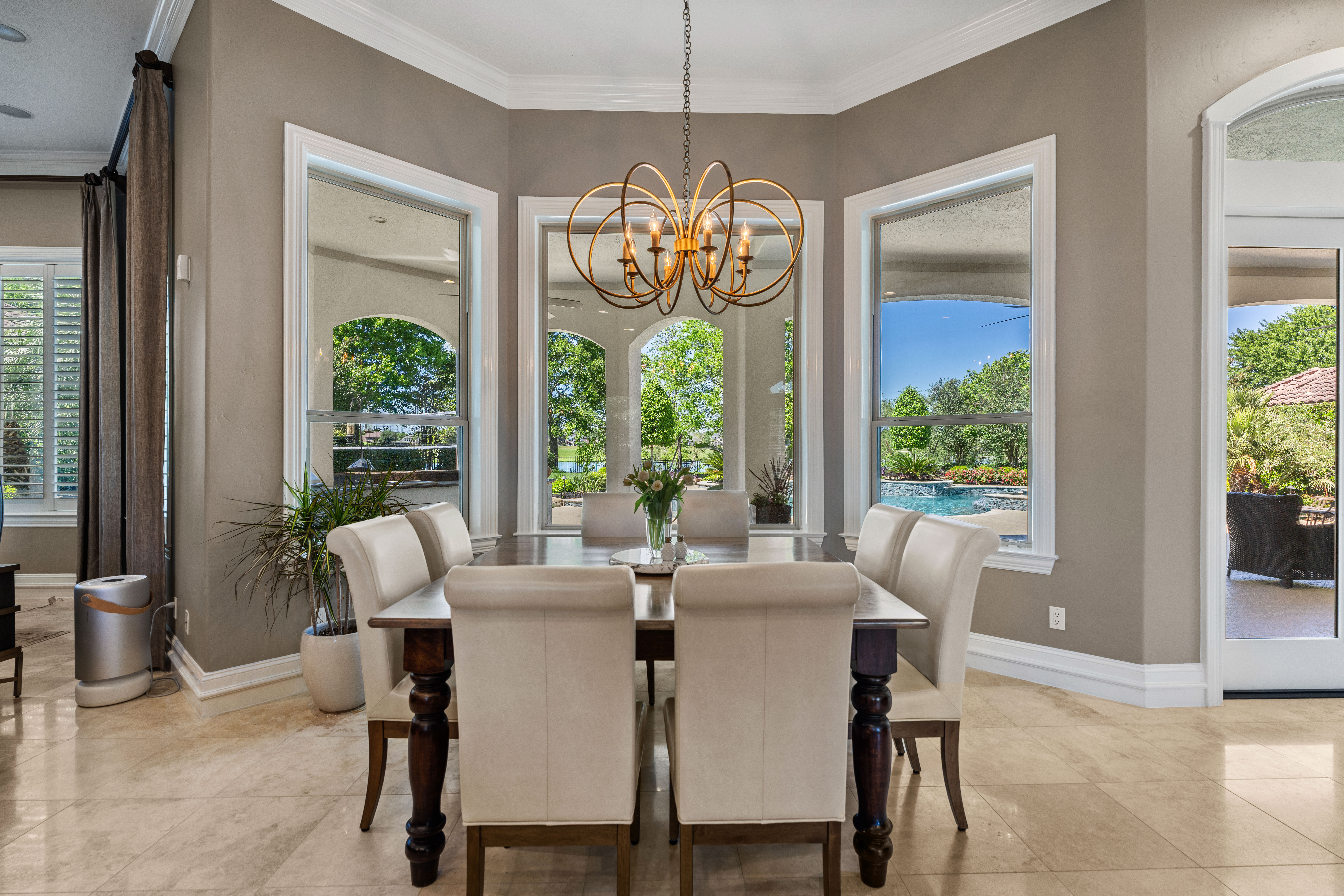 82 Manor Lake Estates Circle Spring, TX 77379 - Photo 13 of 52 a view of a dining room with furniture large windows and wooden floor