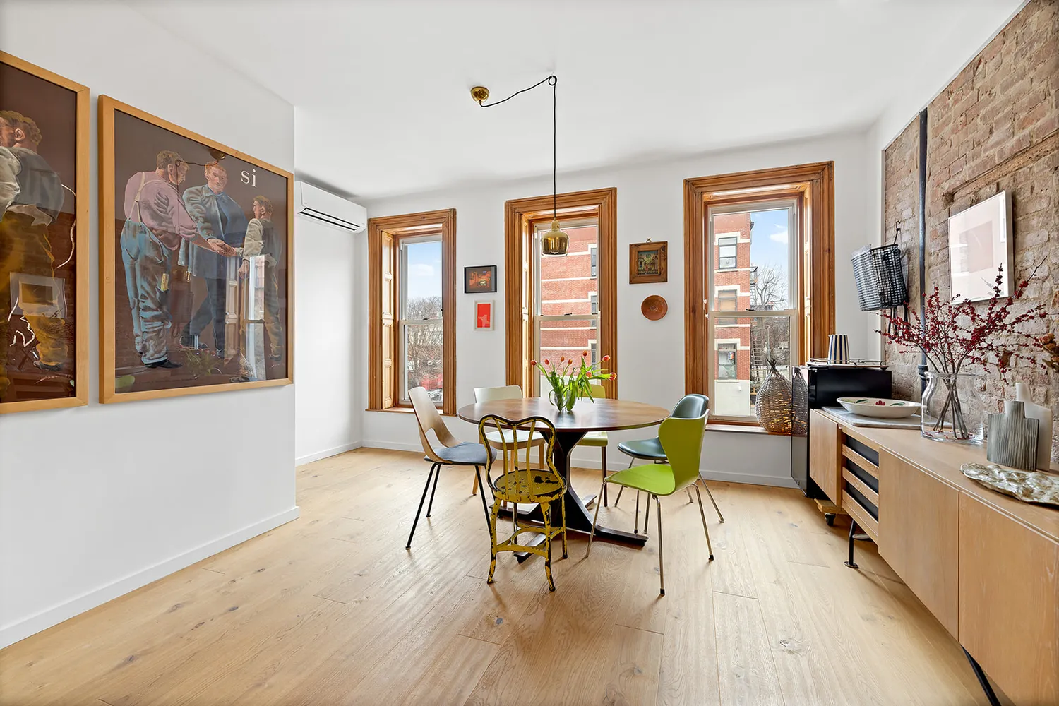 a view of a dining room with furniture window and outside view