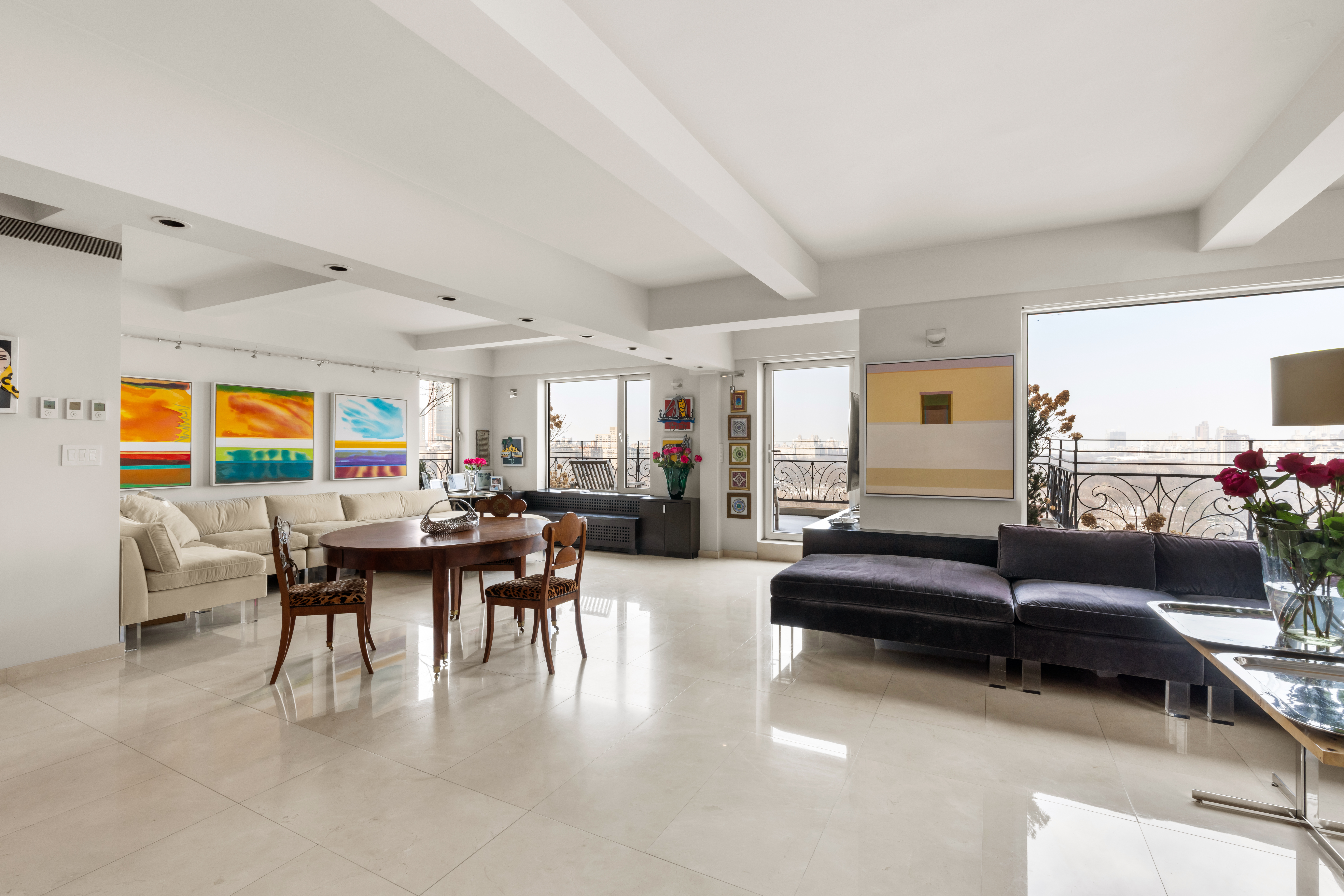 120 Central Park South, Unit PHE/W Manhattan, NY 10019 - Photo 2 of 11 a living room with furniture and wooden floor