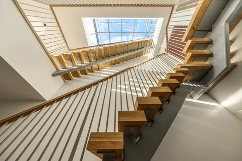 a view of a hallway with windows
