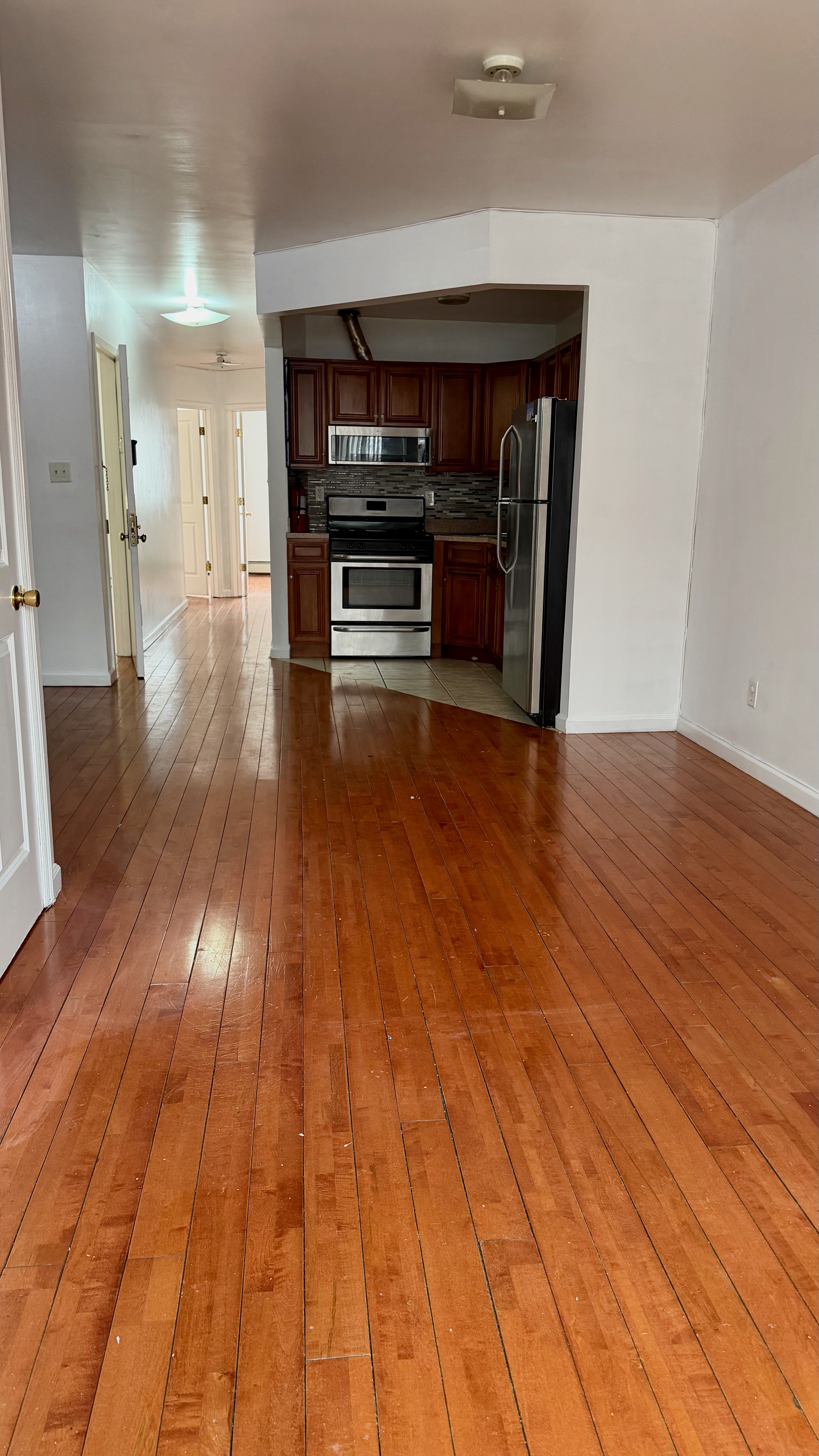 48 Schenck Avenue, Unit 3 Brooklyn, NY 11207 - Photo 2 of 7 a view of empty room with wooden floor
