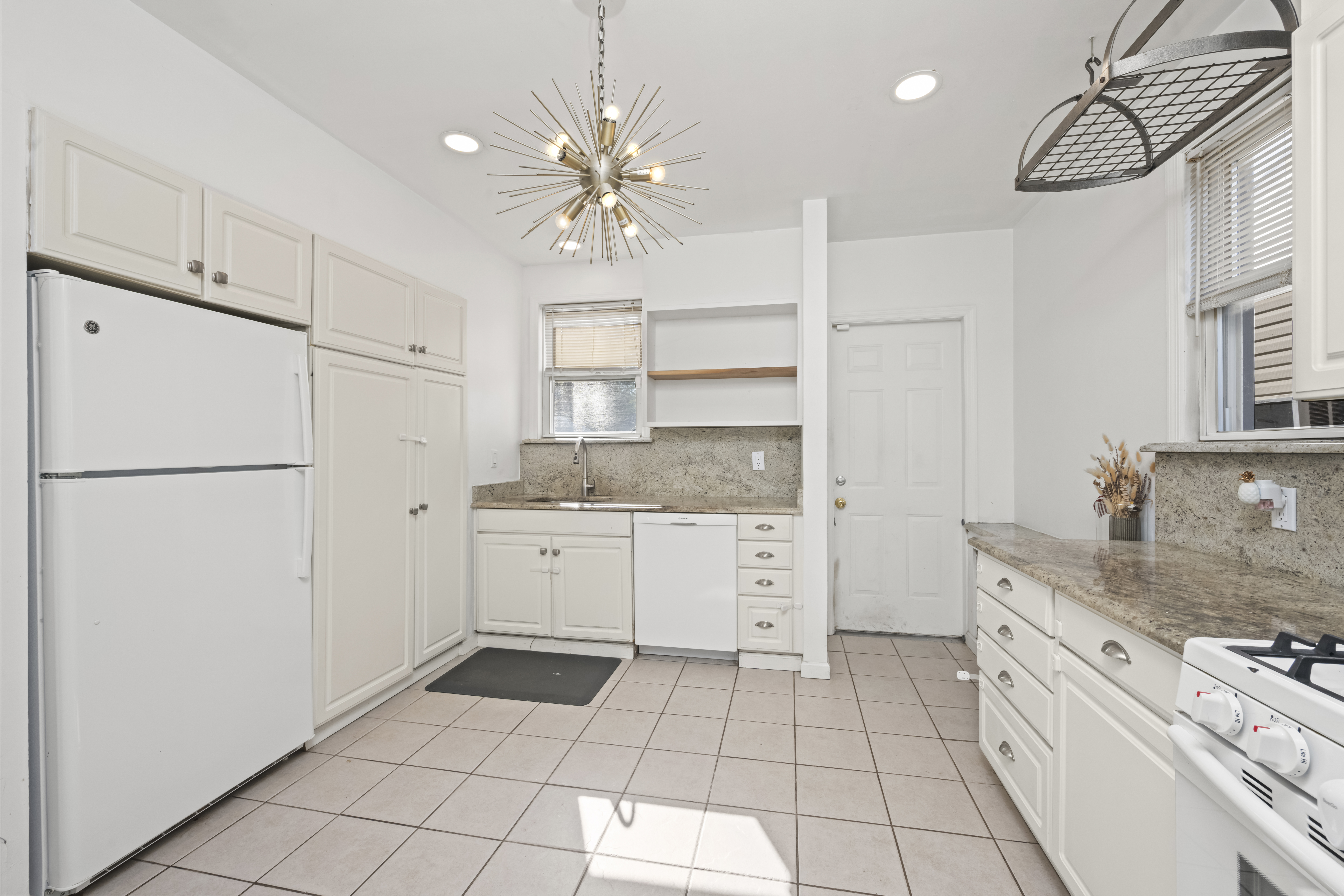 704 Delafield Avenue Staten Island, NY 10310 - Photo 13 of 35 a kitchen with a refrigerator a sink and dishwasher