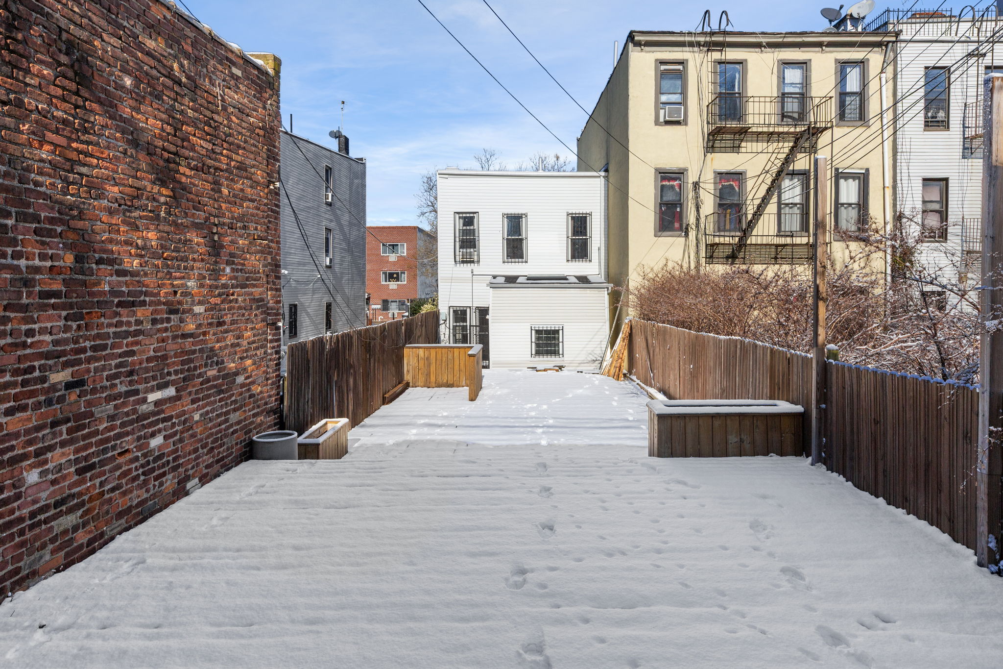 1218 Saint Marks Avenue Brooklyn, NY 11213 - Photo 35 of 42 a view of a brick house with many windows