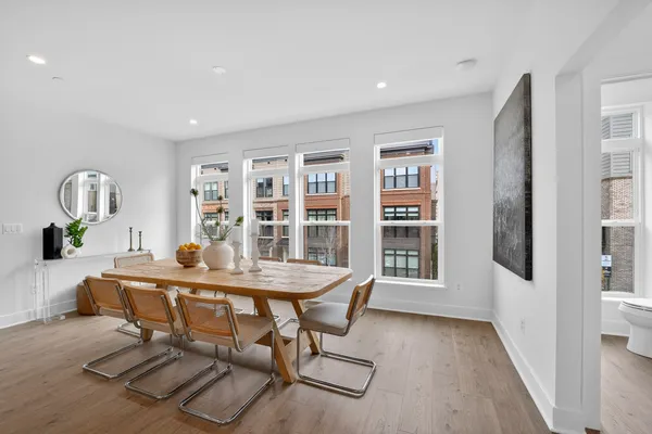 a view of a dining room with furniture window and wooden floor
