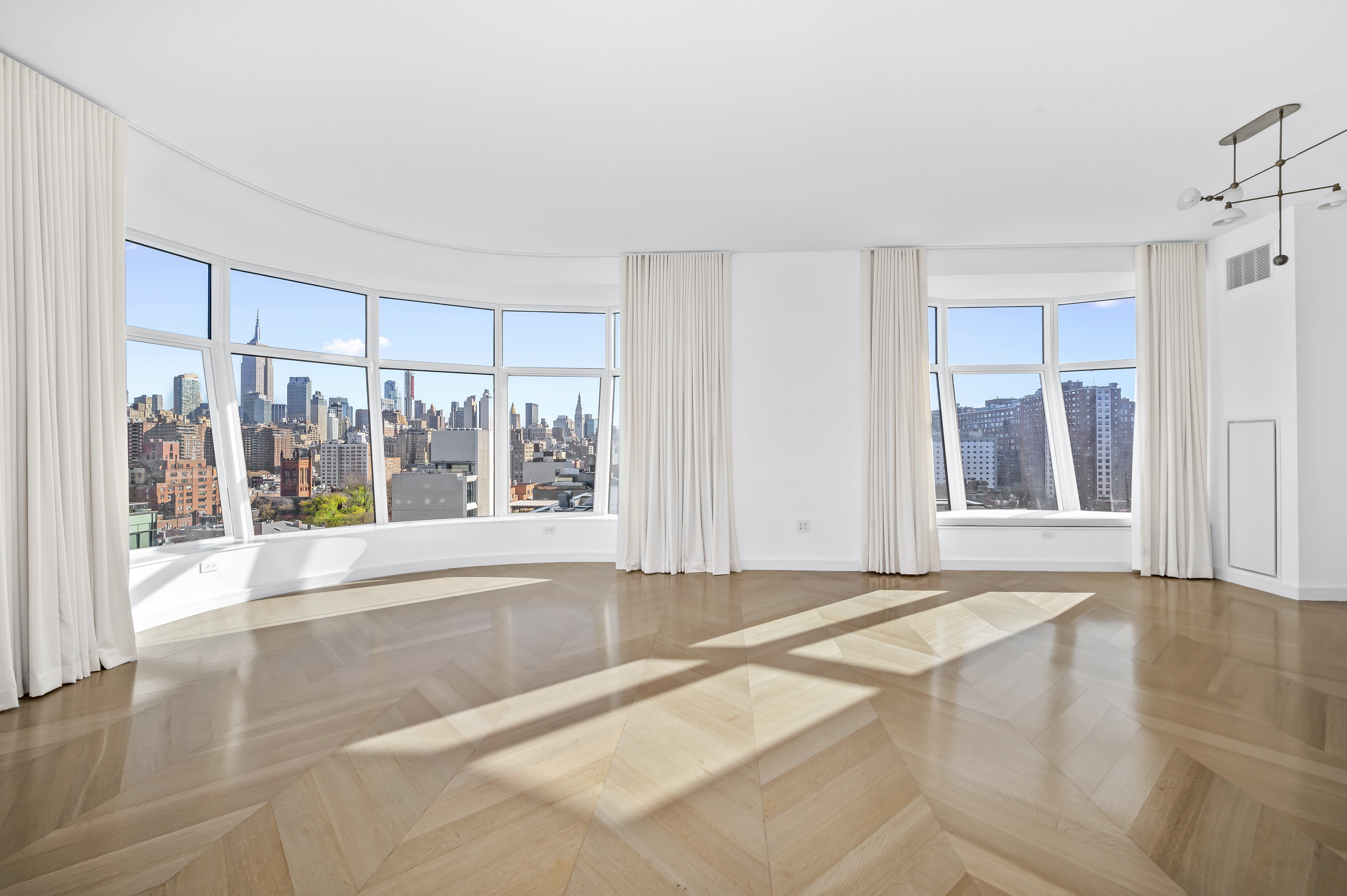 515 West 18th Street, Unit 1401 Manhattan, NY 10011 - Photo 3 of 12 a view of a room with window and couch