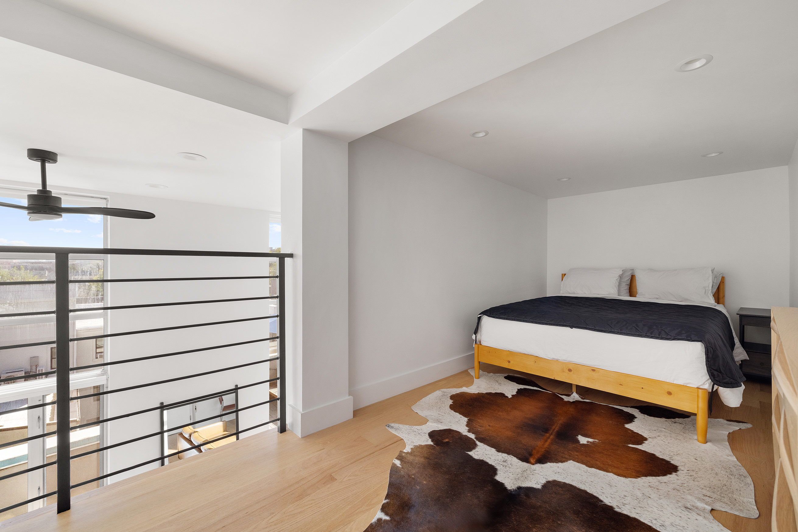 109 Waverly Avenue, Unit 4B Brooklyn, NY 11205 - Photo 6 of 14 a bedroom with a bed and a cabinets