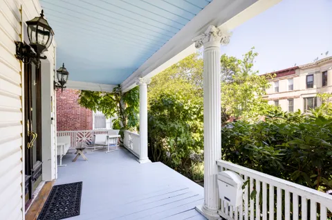 a view of balcony with furniture