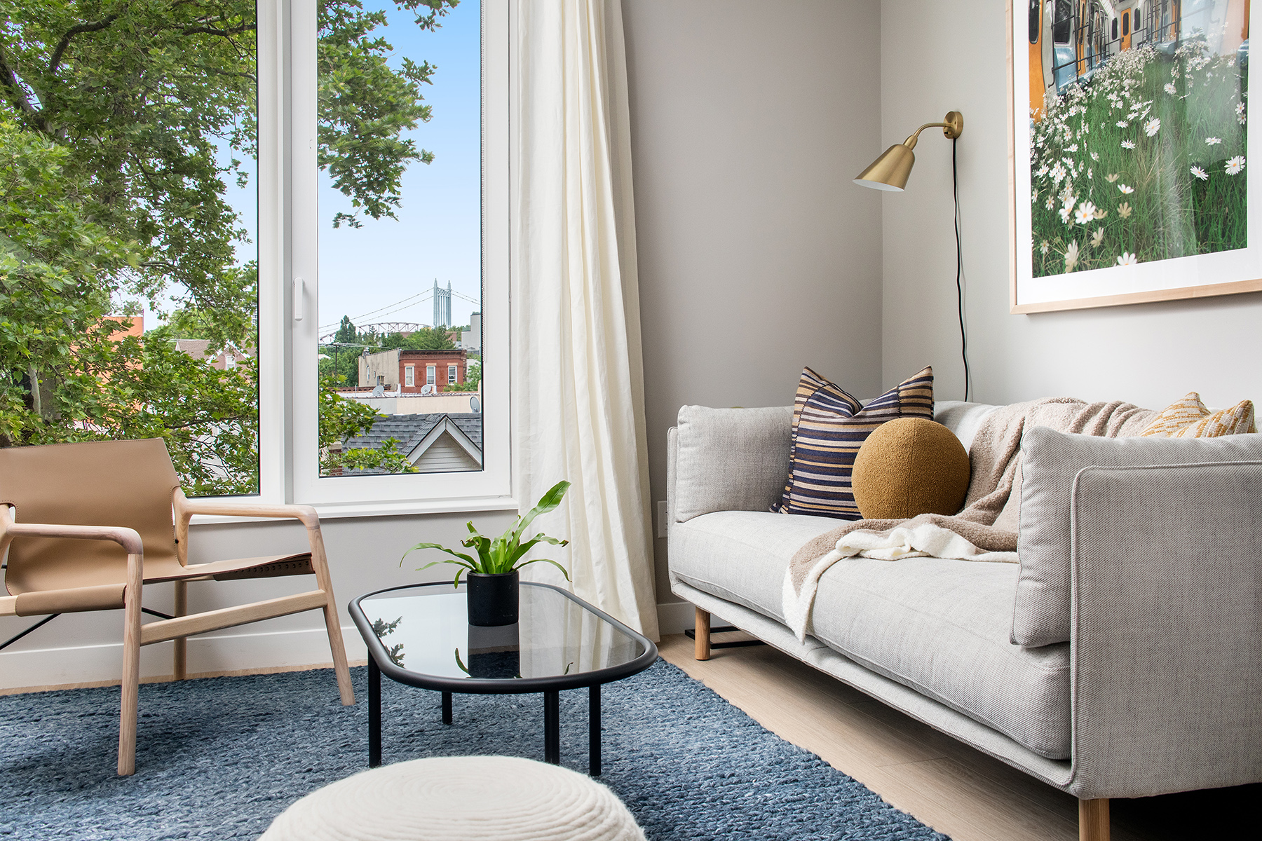 a balcony view with a couch and table chair