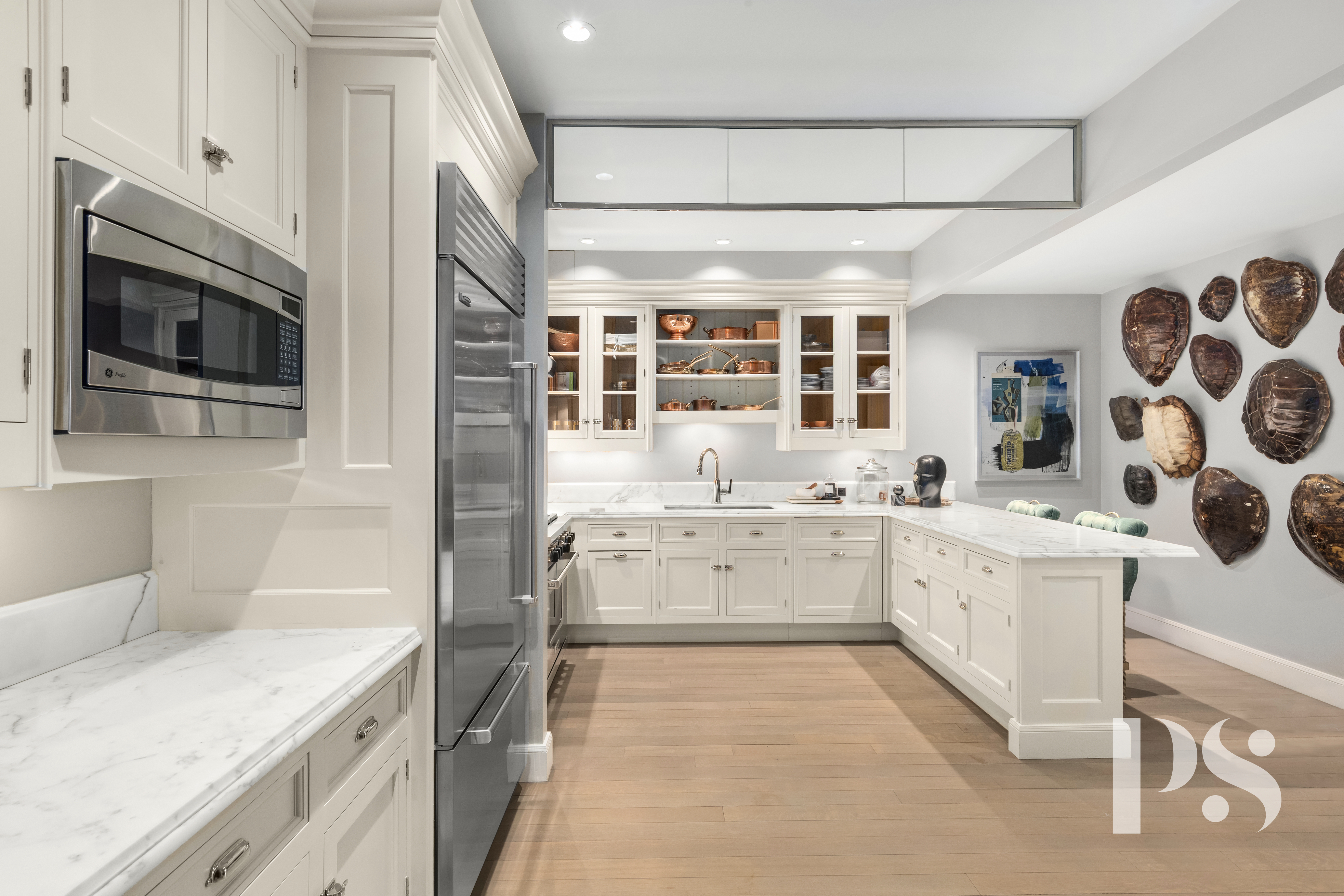 135 East 79th Street, Unit 8E Manhattan, NY 10075 - Photo 13 of 26 a kitchen with a sink stove and microwave