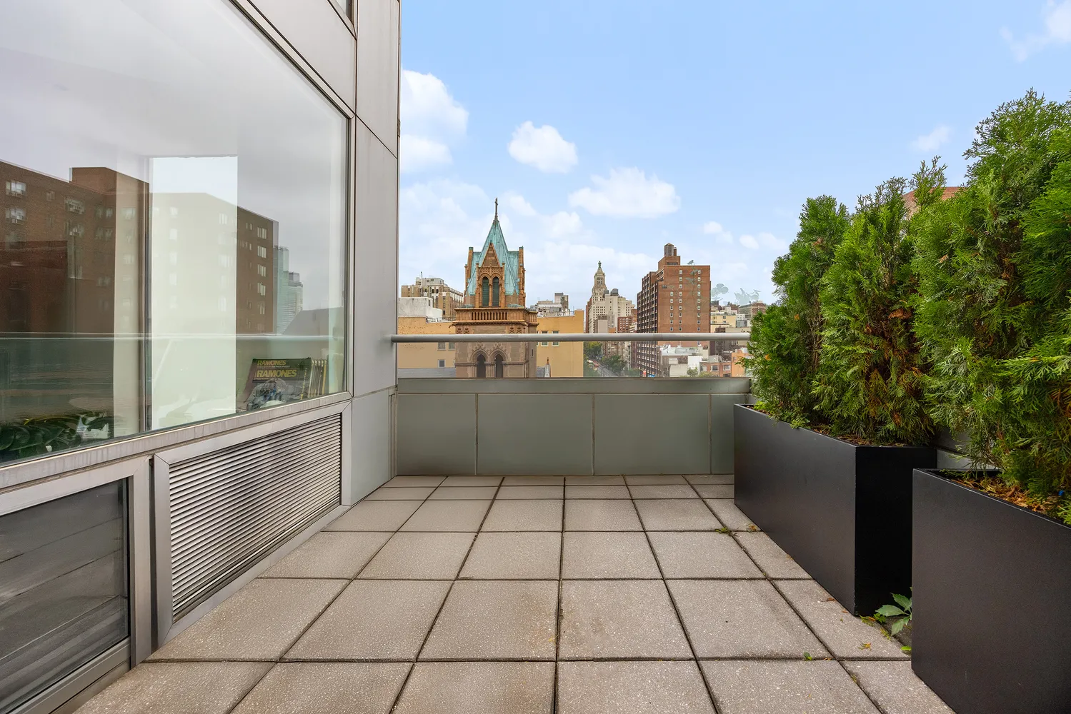 a kitchen with a sink a counter top space and cabinets