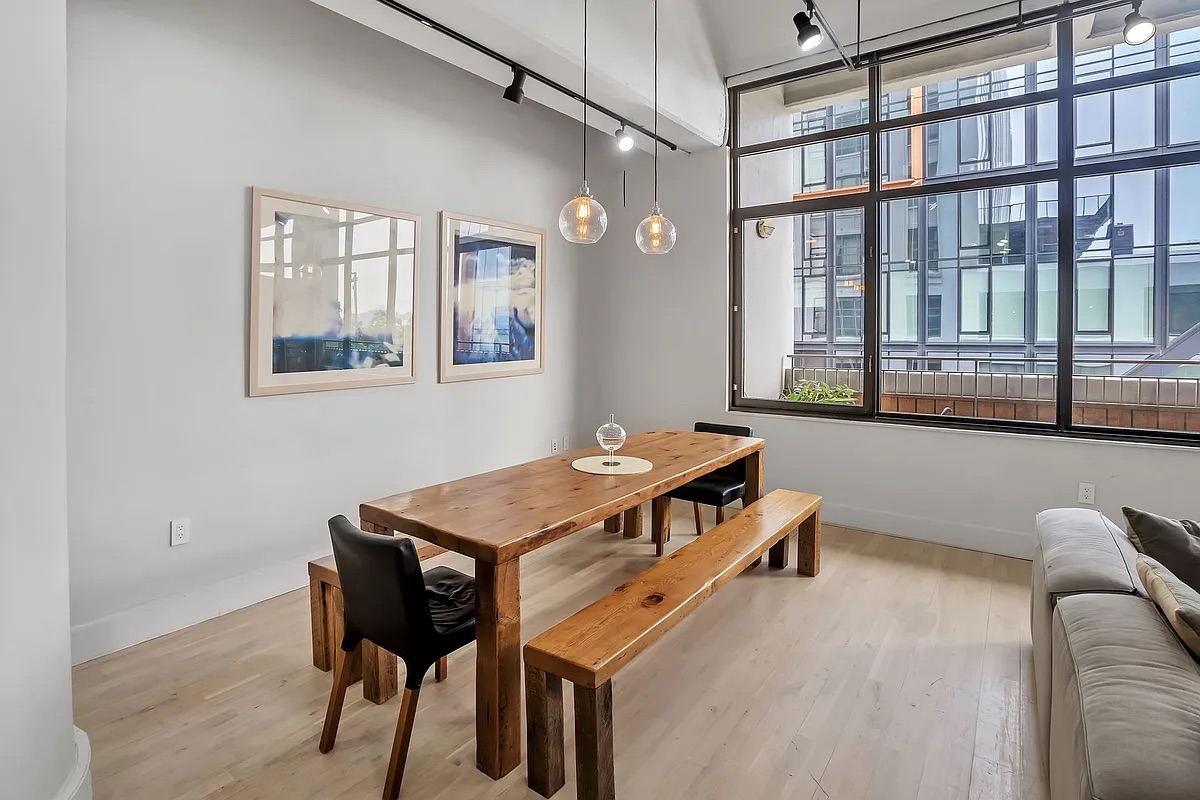 360 Furman Street, Unit 202 Brooklyn, NY 11201 - Photo 8 of 55 a room with a table and chairs