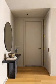 a room with a table and a mirror