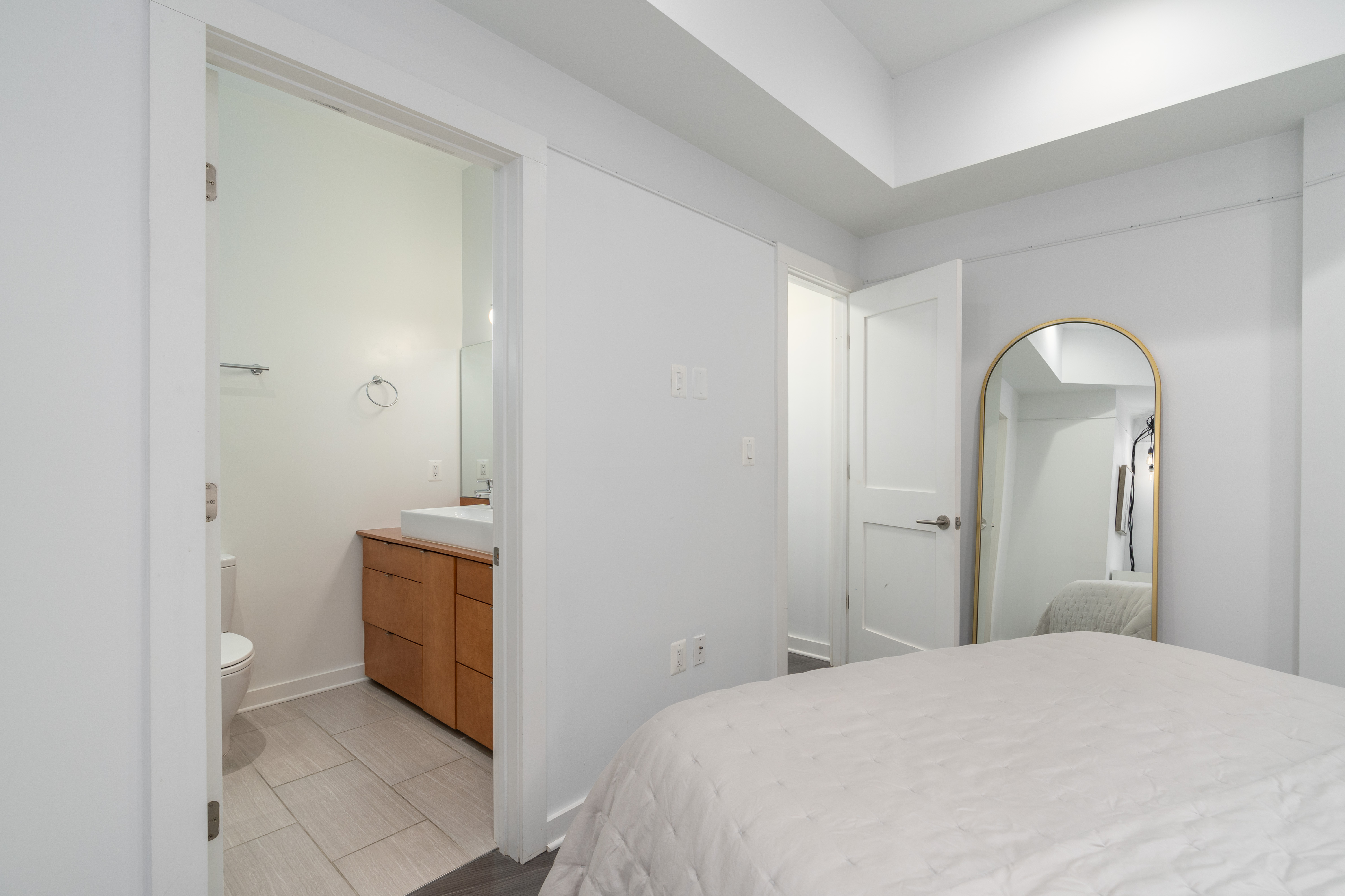 1740 New Jersey Avenue Northwest, Unit 2 Washington, DC 20001 - Photo 16 of 35 a en suite bathroom with a granite countertop sink and a mirror