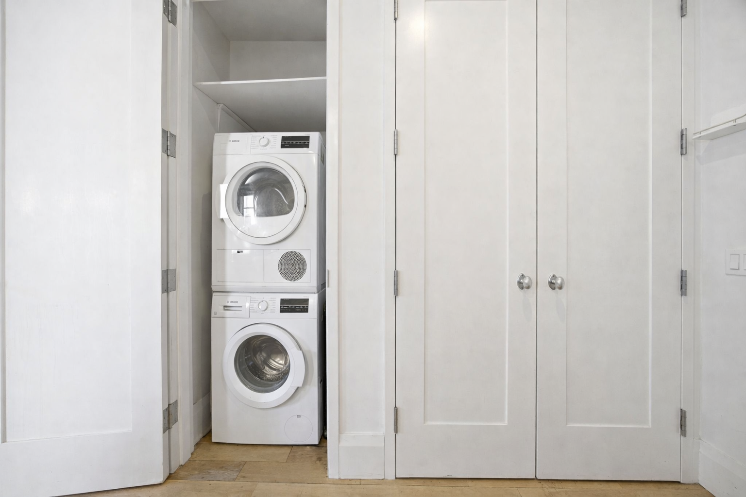71 Nassau Street, Unit 13C Manhattan, NY 10038 - Photo 8 of 16 a utility room with dryer and washer
