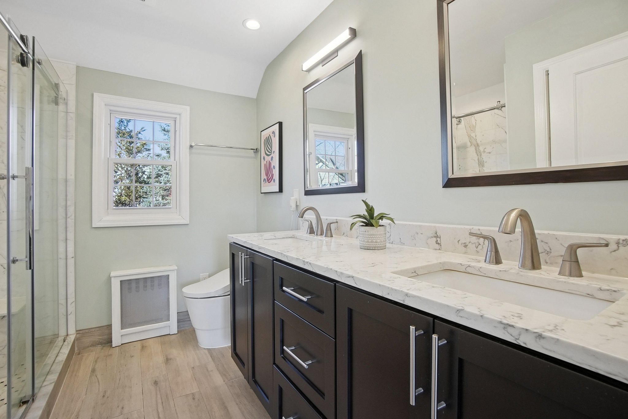 877 Ridgewood Road Millburn, NJ 07041 - Photo 20 of 37 a bathroom with a granite countertop sink a toilet and a mirror