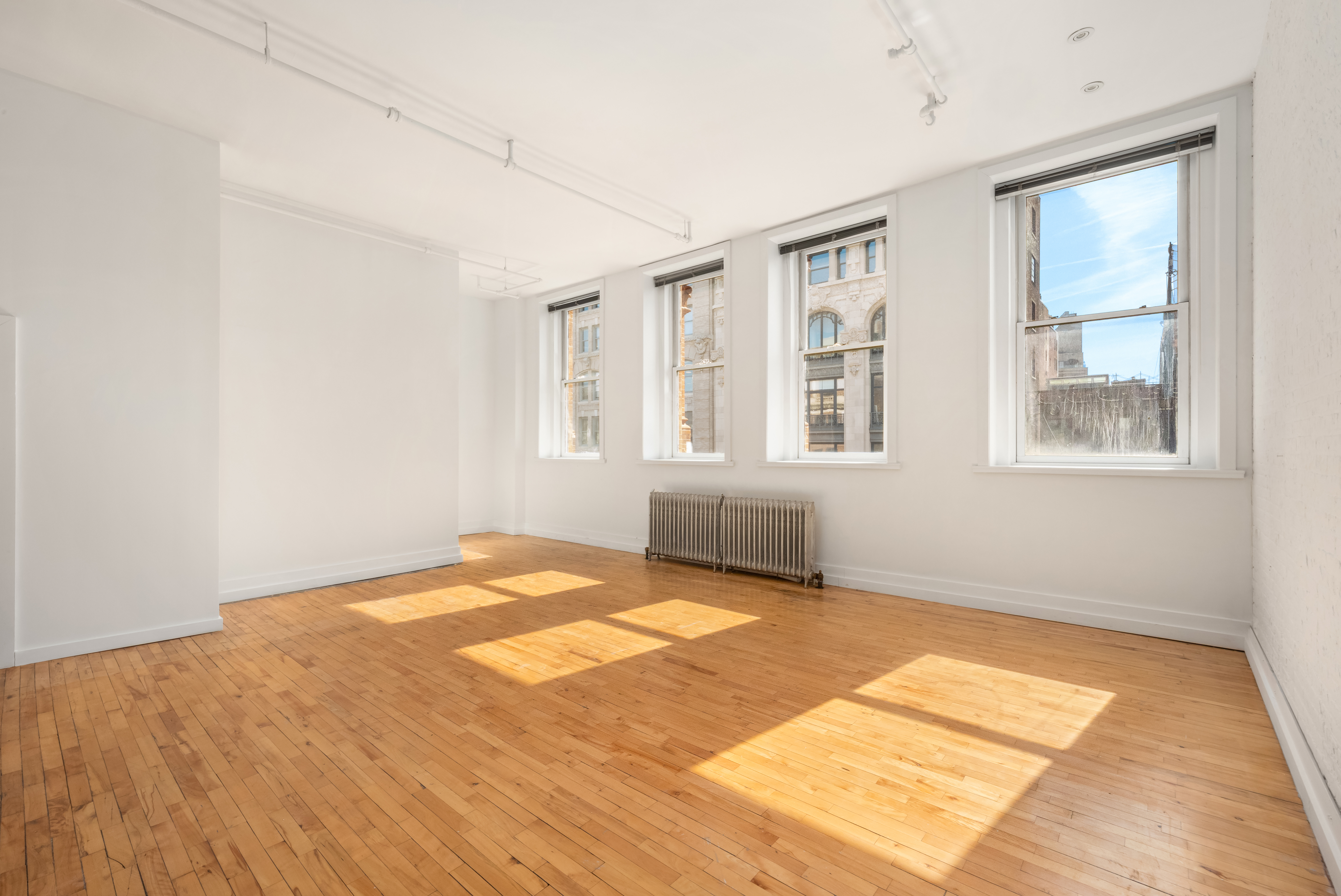 519 Broadway, Unit PHC Manhattan, NY 10012 - Photo 4 of 16 a view of an empty room with a window