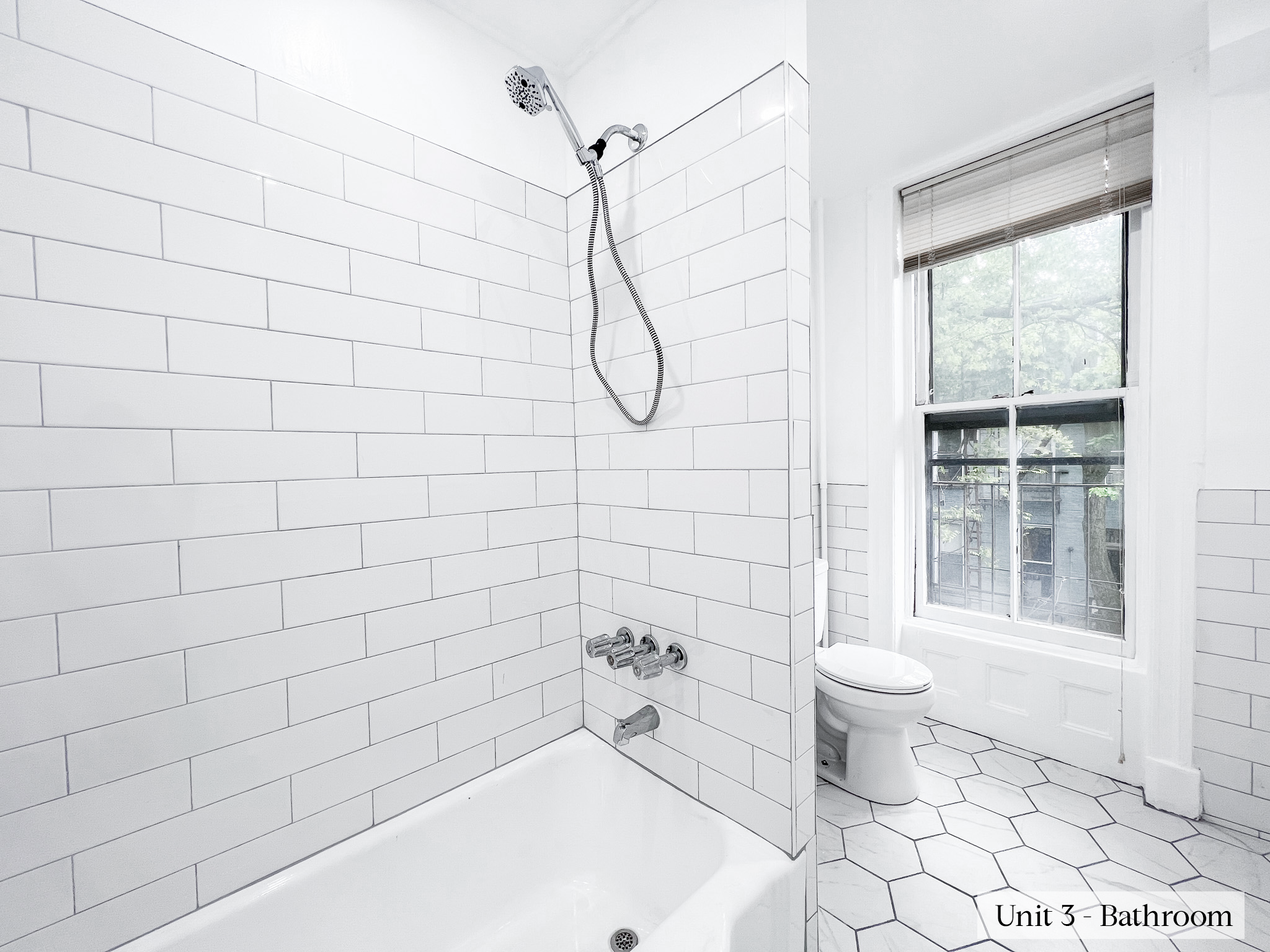 460 9th Street Brooklyn, NY 11215 - Photo 17 of 24 a bathroom with a toilet sink and shower