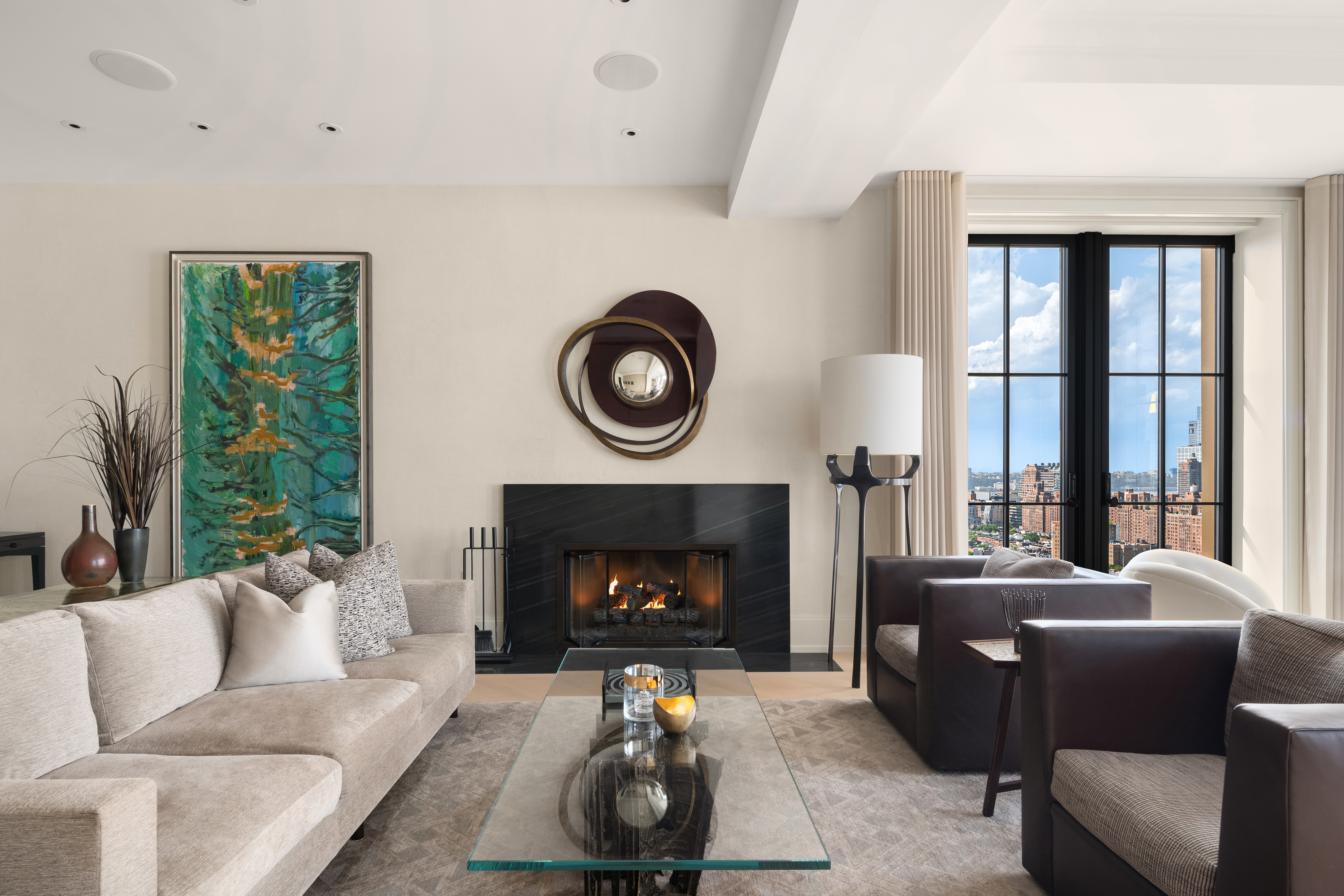 212 West 18th Street, Unit 19C Manhattan, NY 10011 - Photo 4 of 27 a living room with furniture and a fireplace