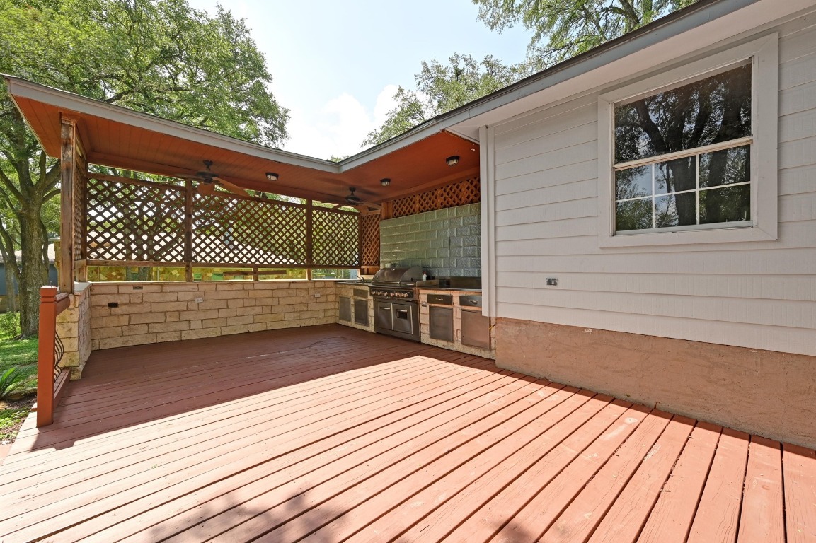 111 Trinity Street Cedar Creek, TX 78612 - Photo 27 of 38 a view of a balcony with wooden floor and fence and a floor to ceiling window