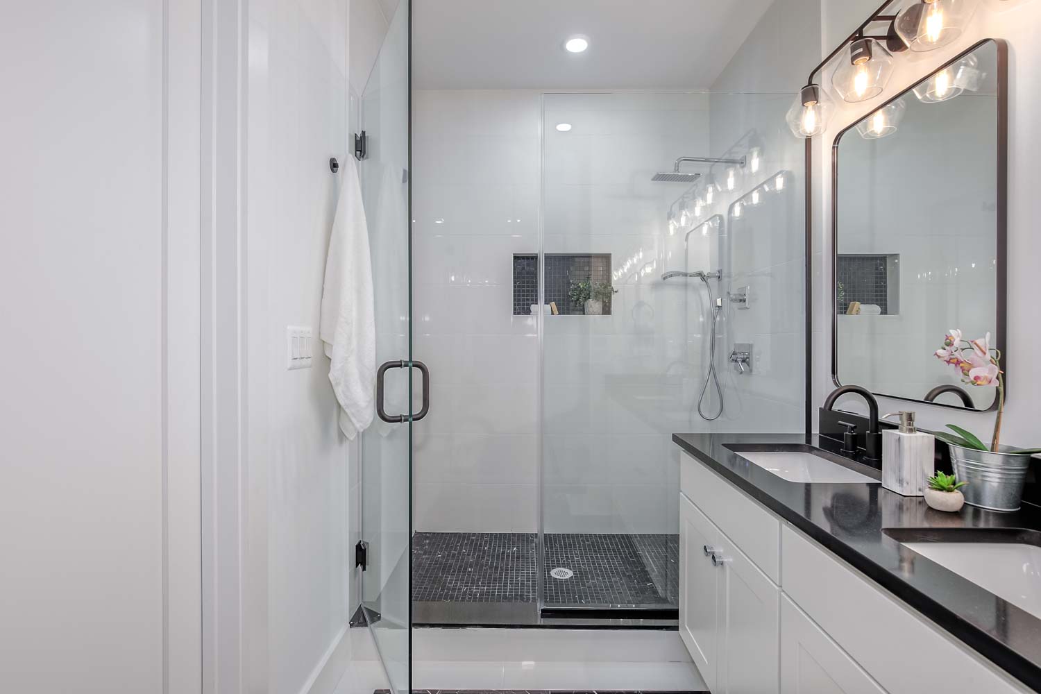 428 Manor Place Northwest, Unit 1 Washington, DC 20010 - Photo 16 of 27 a bathroom with a granite countertop sink a mirror and shower