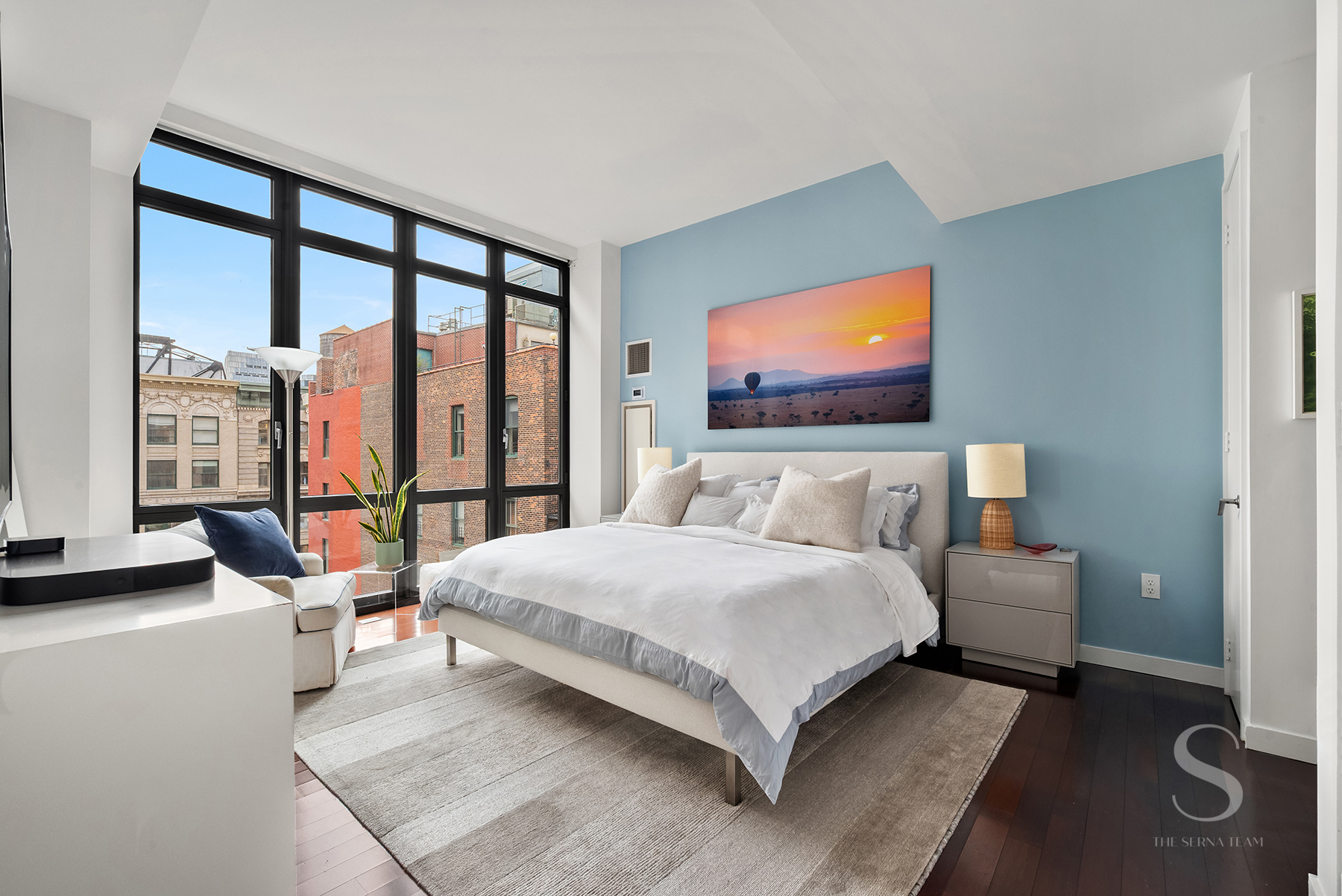 4 West 21st Street, Unit 14A Manhattan, NY 10010 - Photo 6 of 16 a bedroom with a bed and glass window