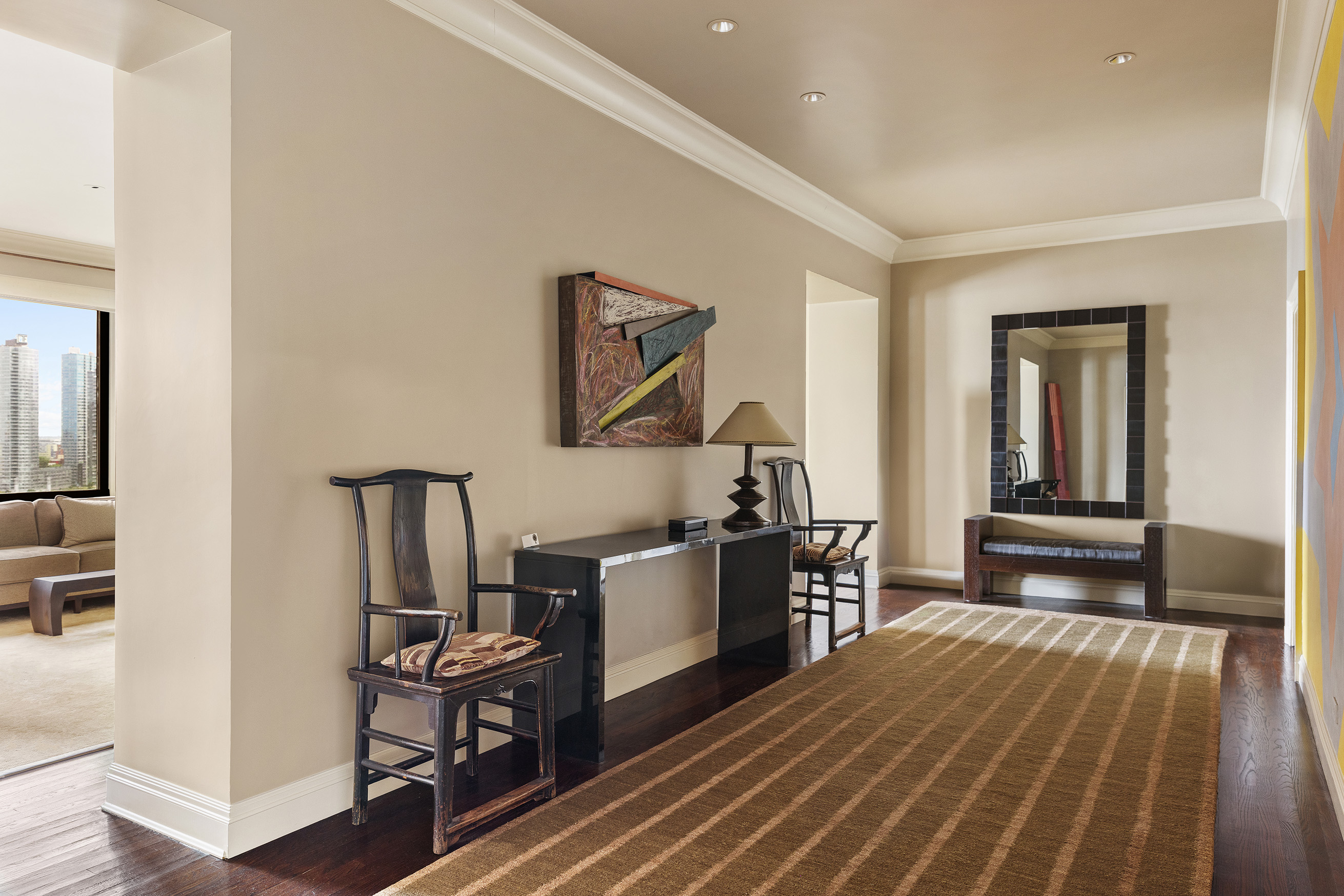 435 East 52nd Street, Unit 11A Manhattan, NY 10022 - Photo 12 of 21 a kitchen with a sink and wooden floor