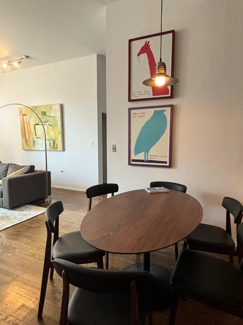 250 Mercer Street, Unit D603 Manhattan, NY 10012 - Photo 19 of 20 a view of a dining room with furniture and wooden floor